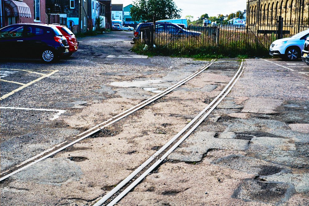 tram tracks to fence