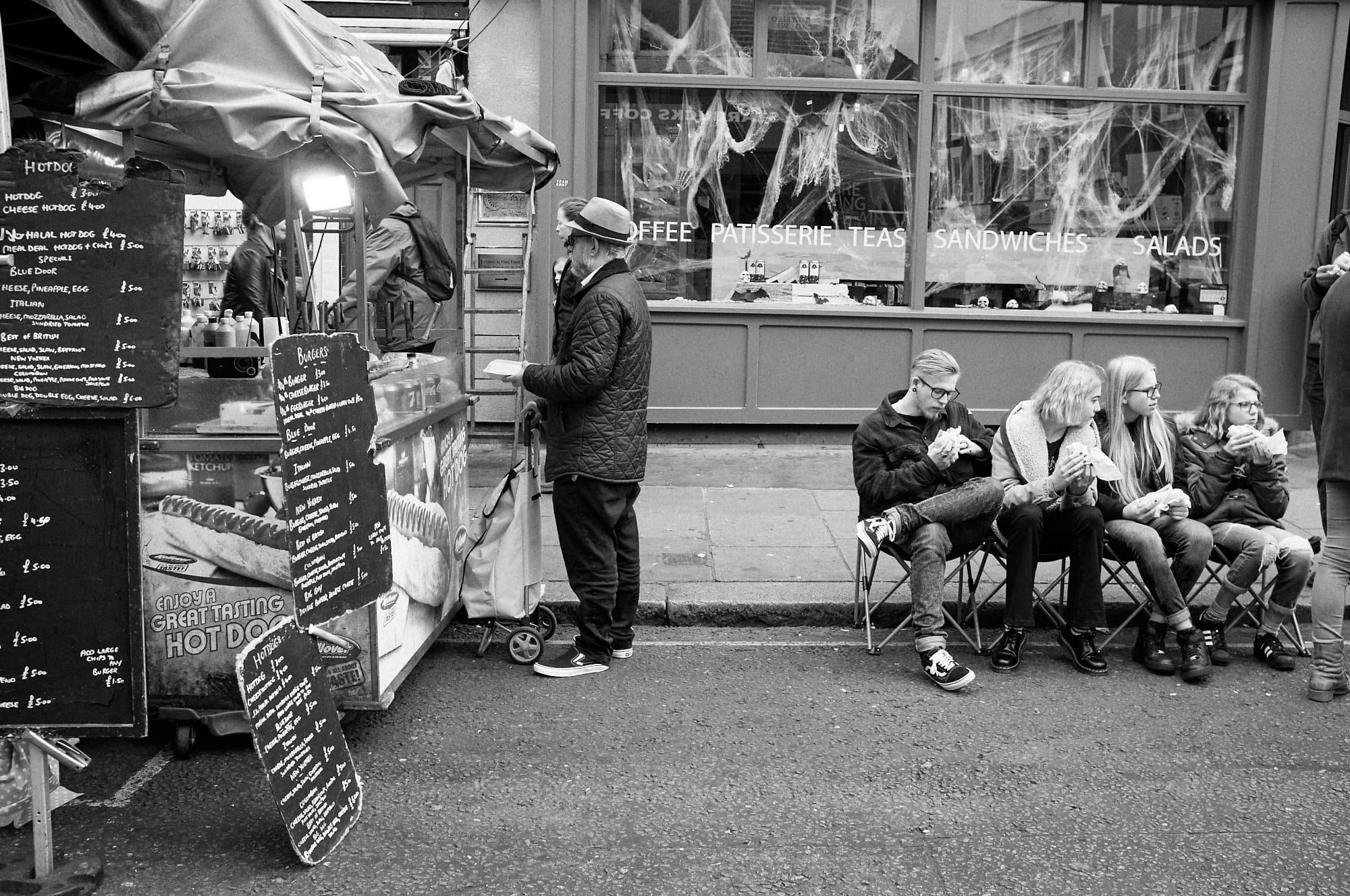 people seated eating street food