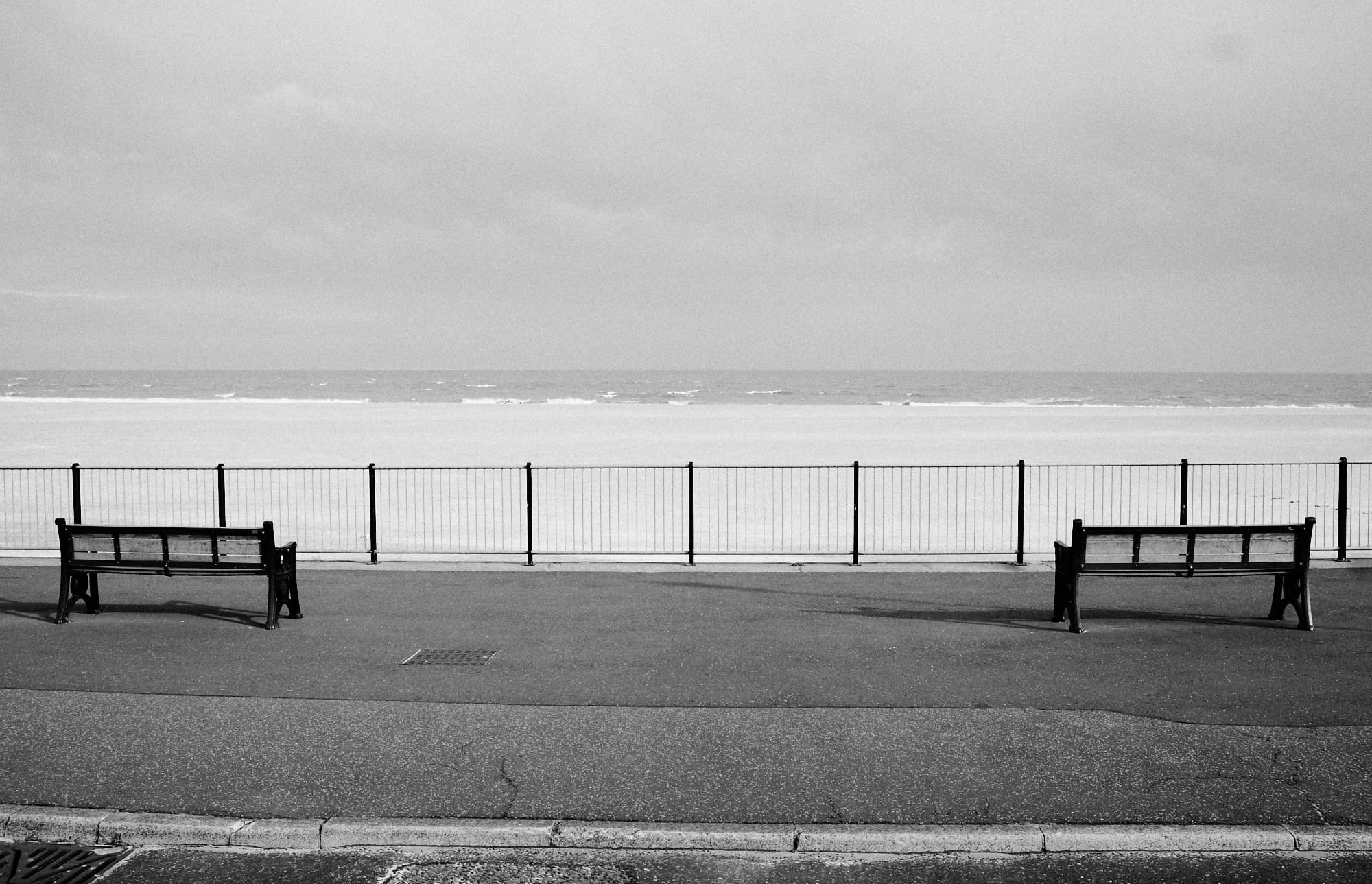 lower level promenade benches facing out to sea
