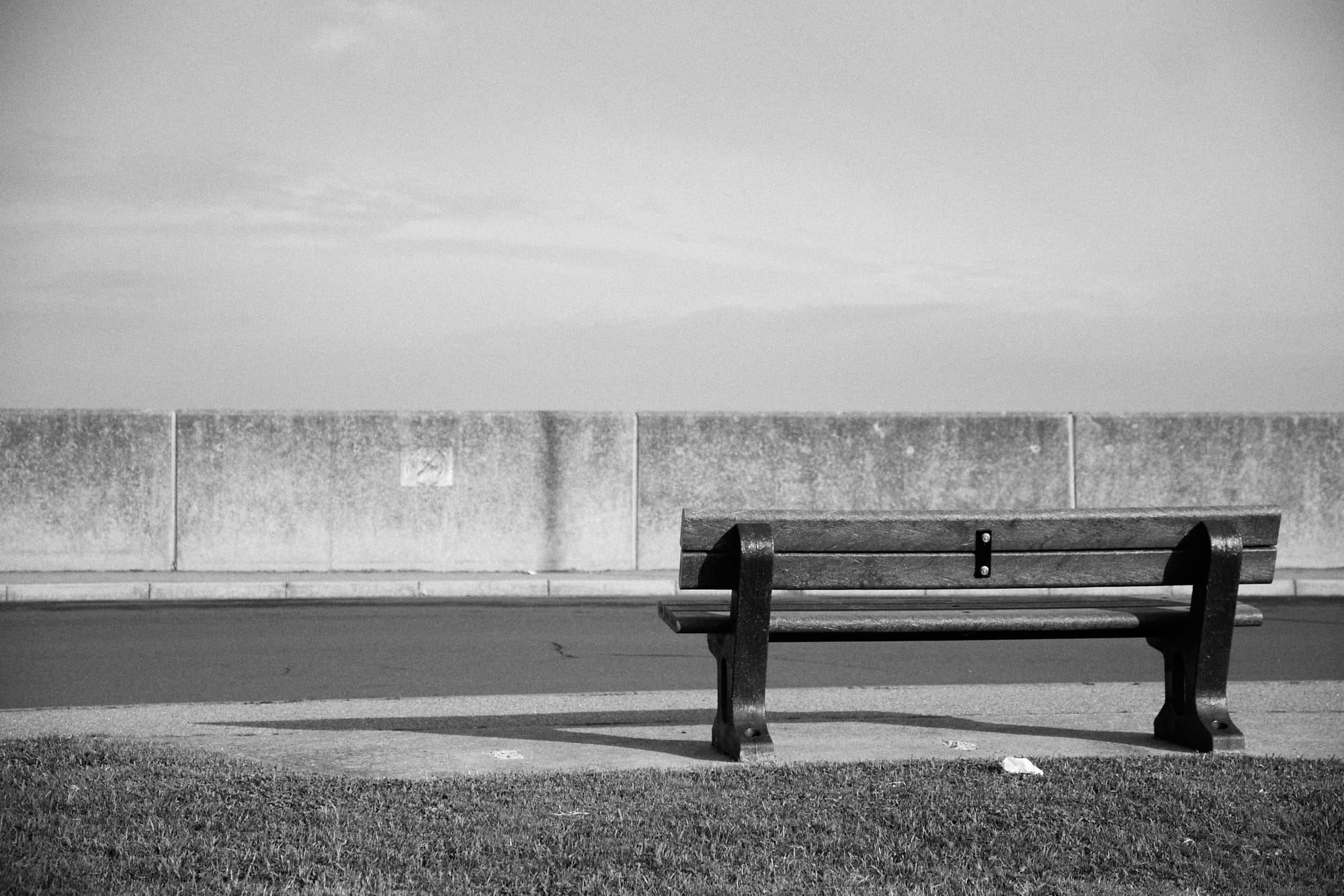 bench facing a sea wall