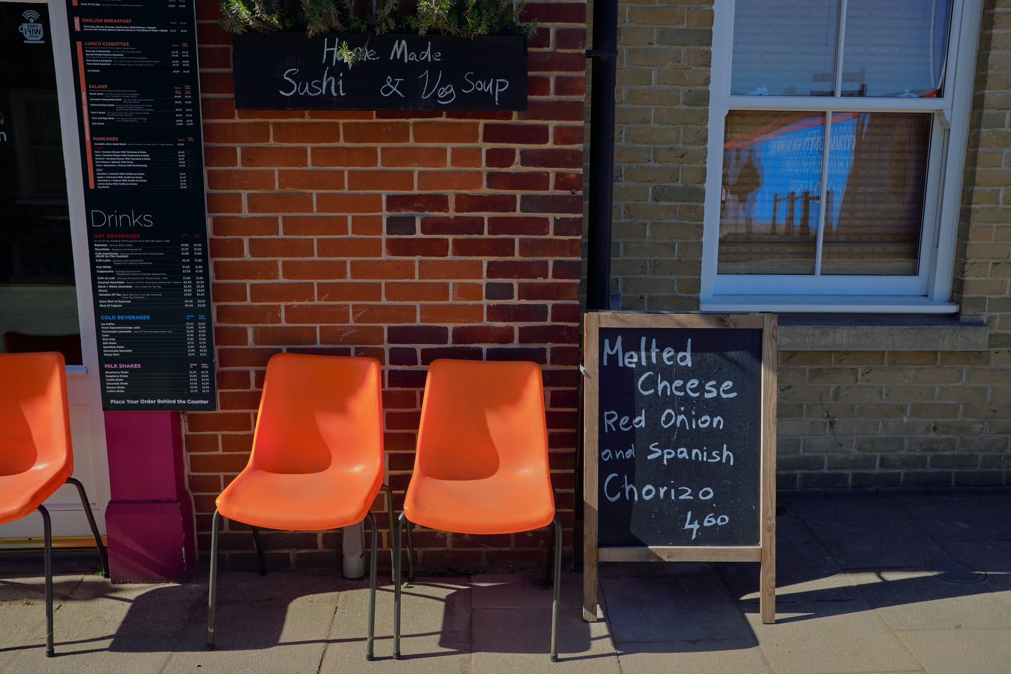orange chairs outside cafe