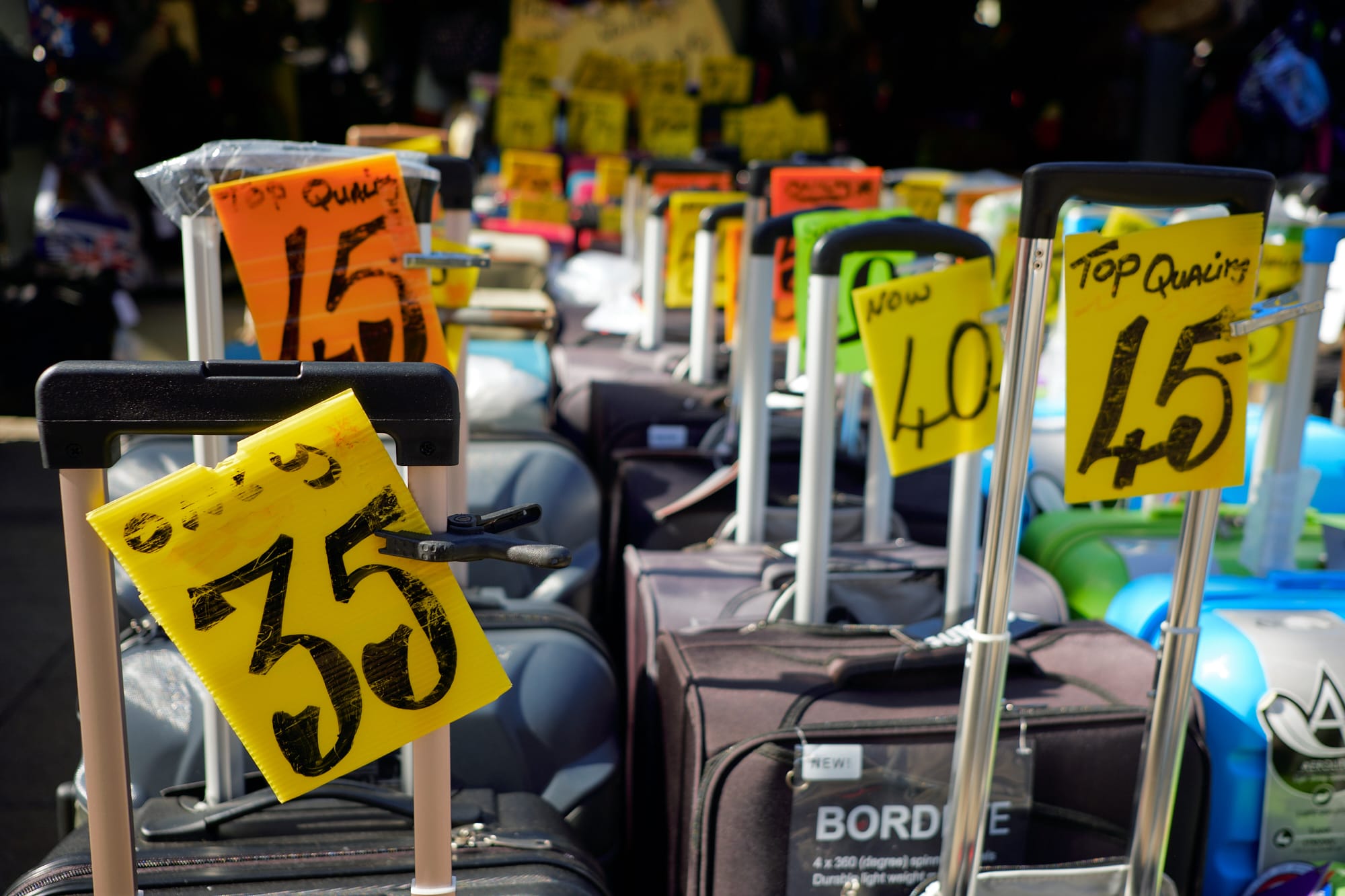 luggage price signs at market