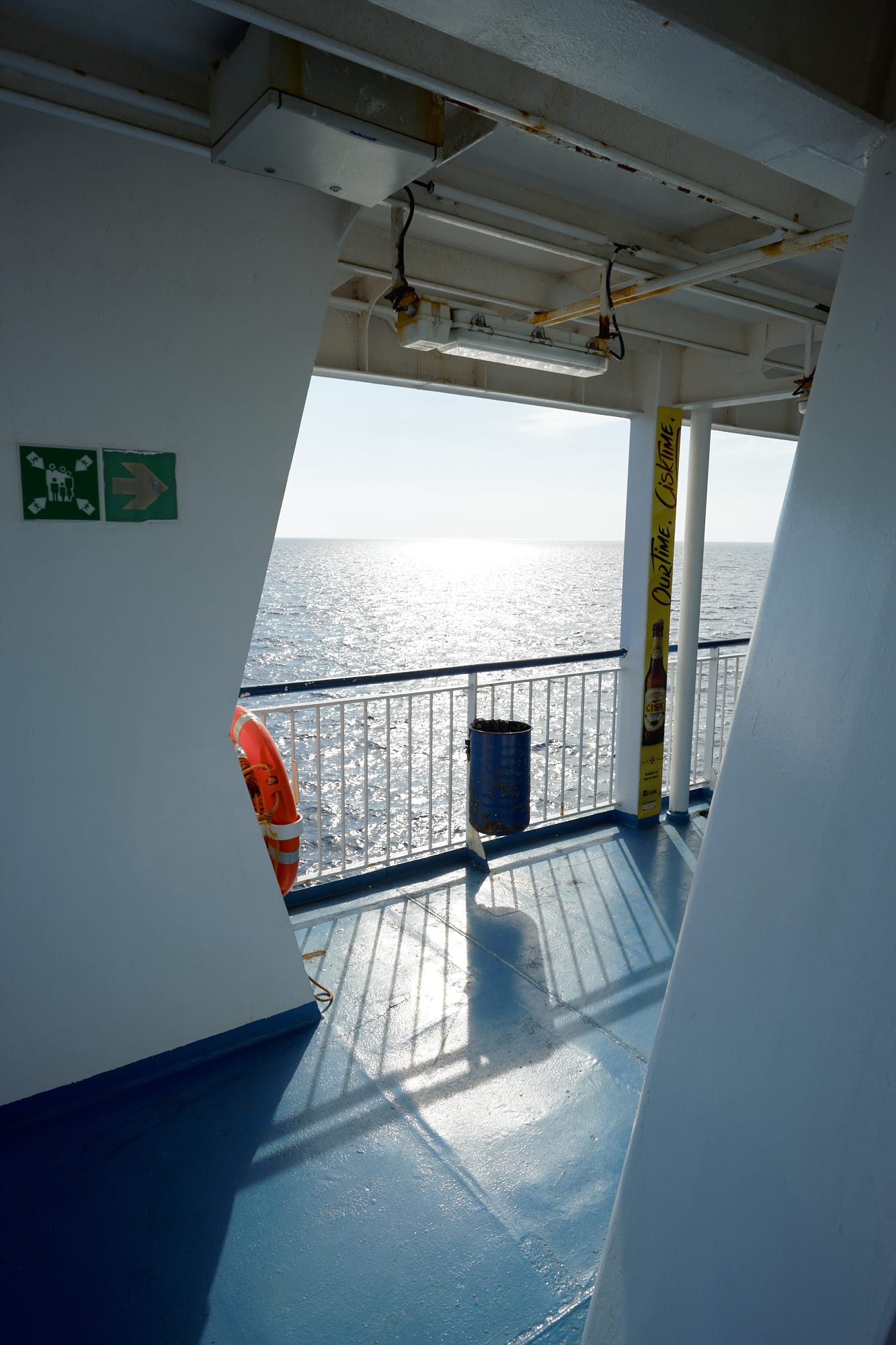 looking out over the side of the ferry towards the sun