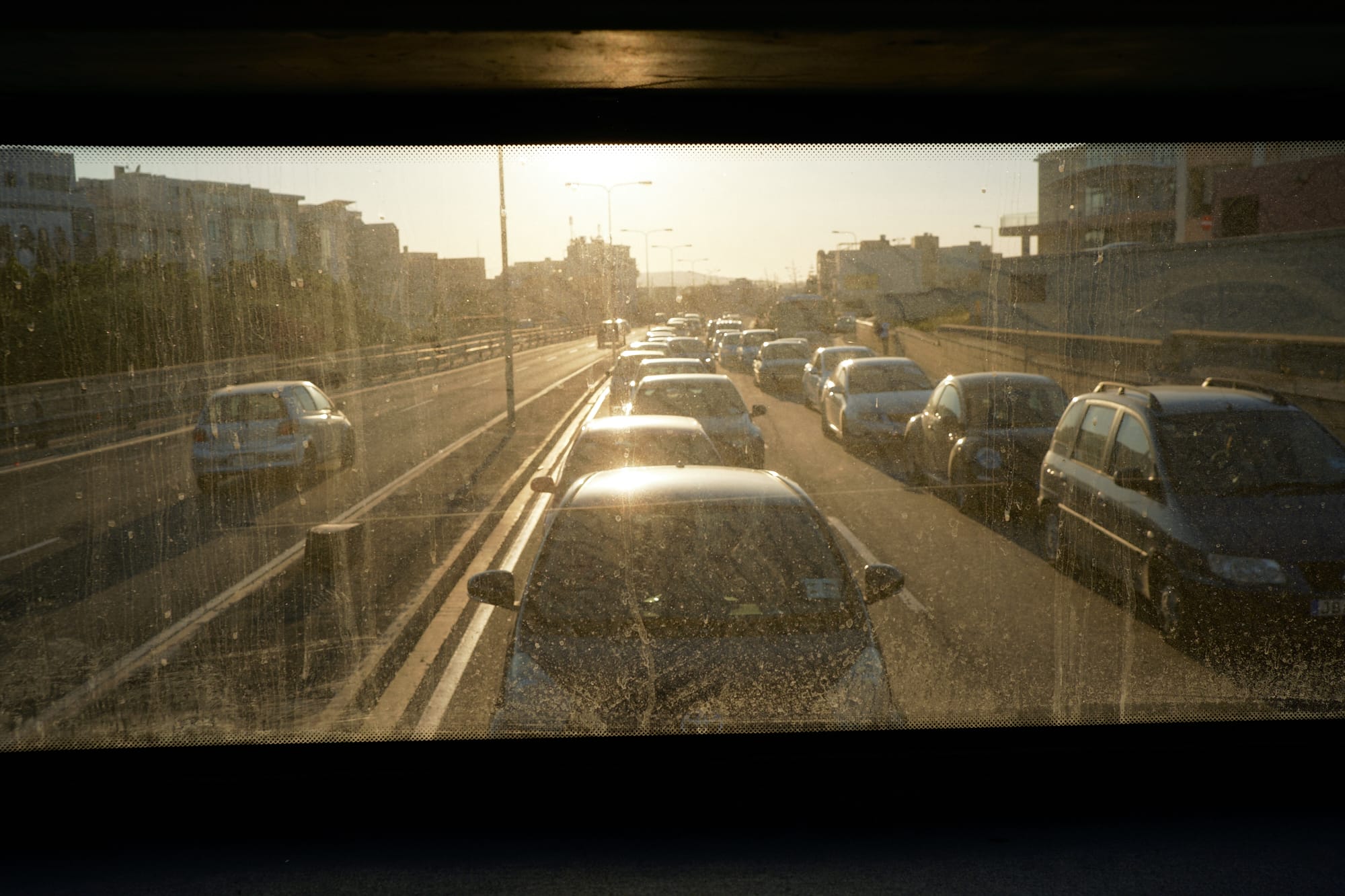 sun shining in the rear window of the bus from Ċirkewwa to Valletta