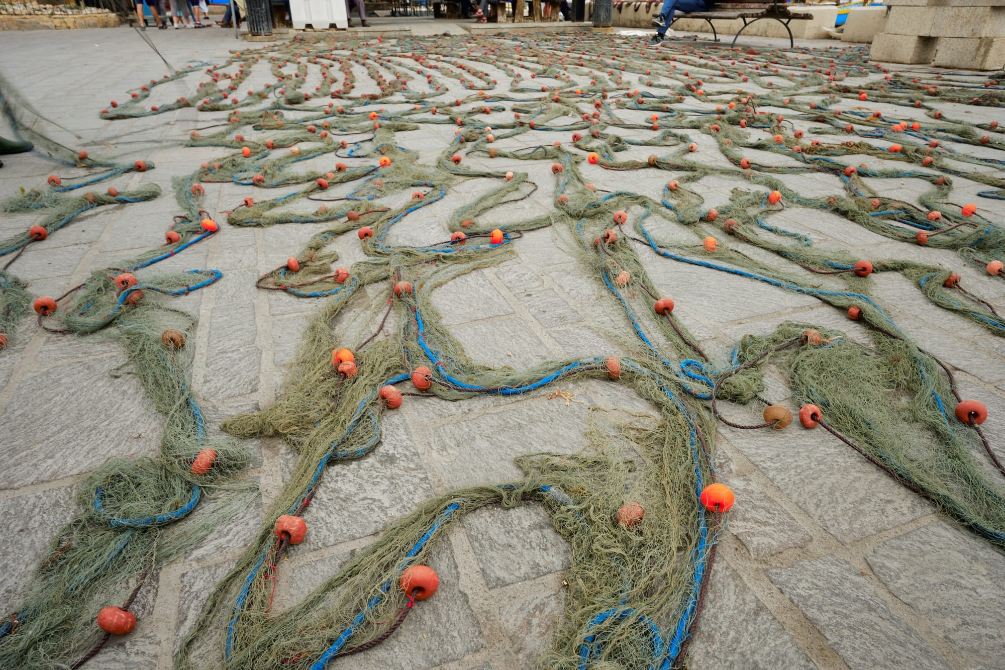 fishing nets spread out on the ground