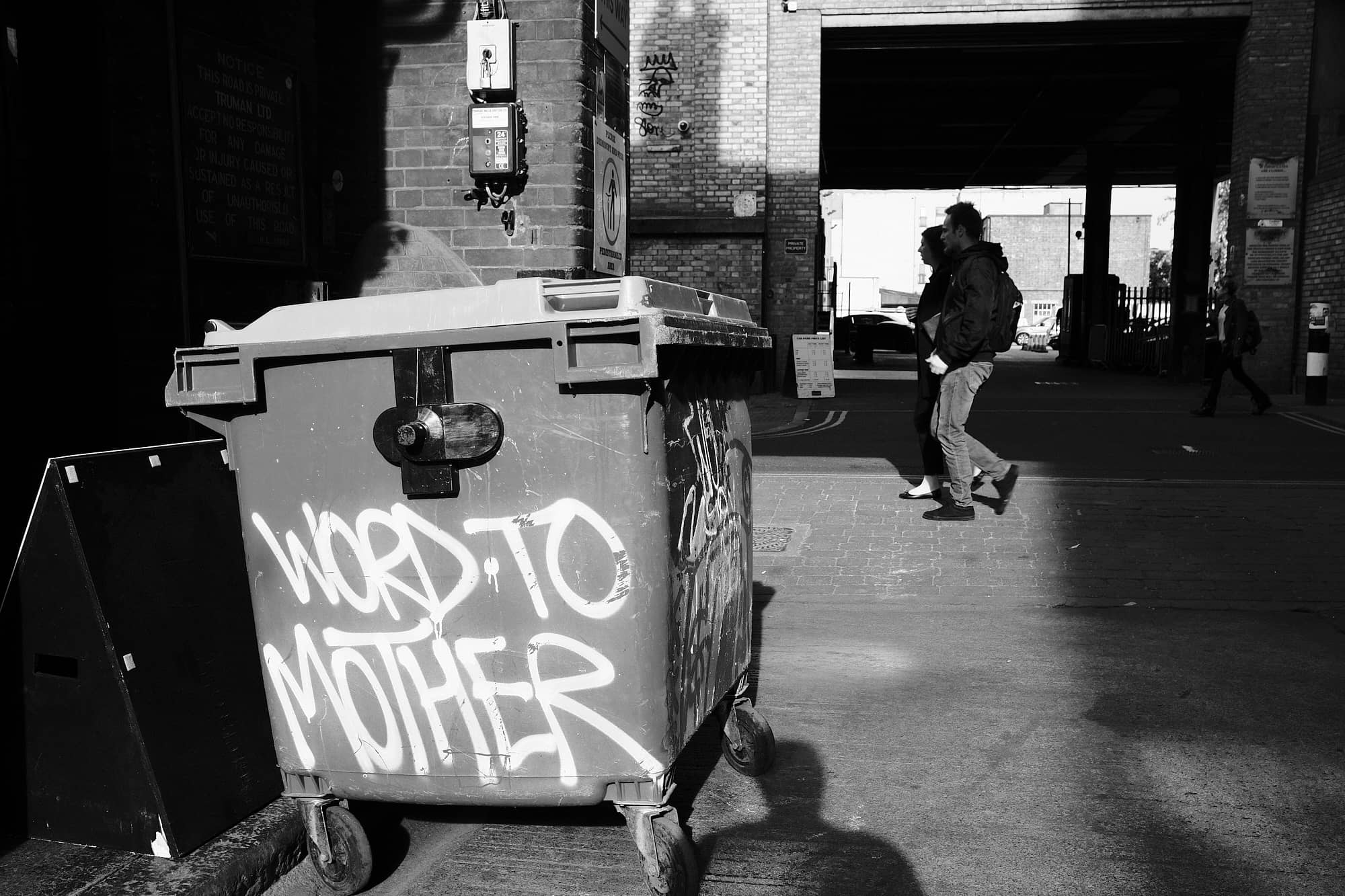 bin with ‘Word To Mother’ sprayed on it