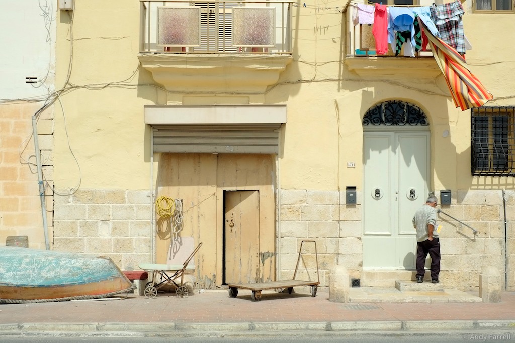 man leaving a house