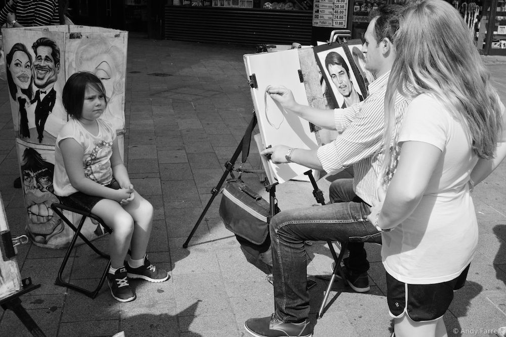 girl having a cartoon portrait of herself made