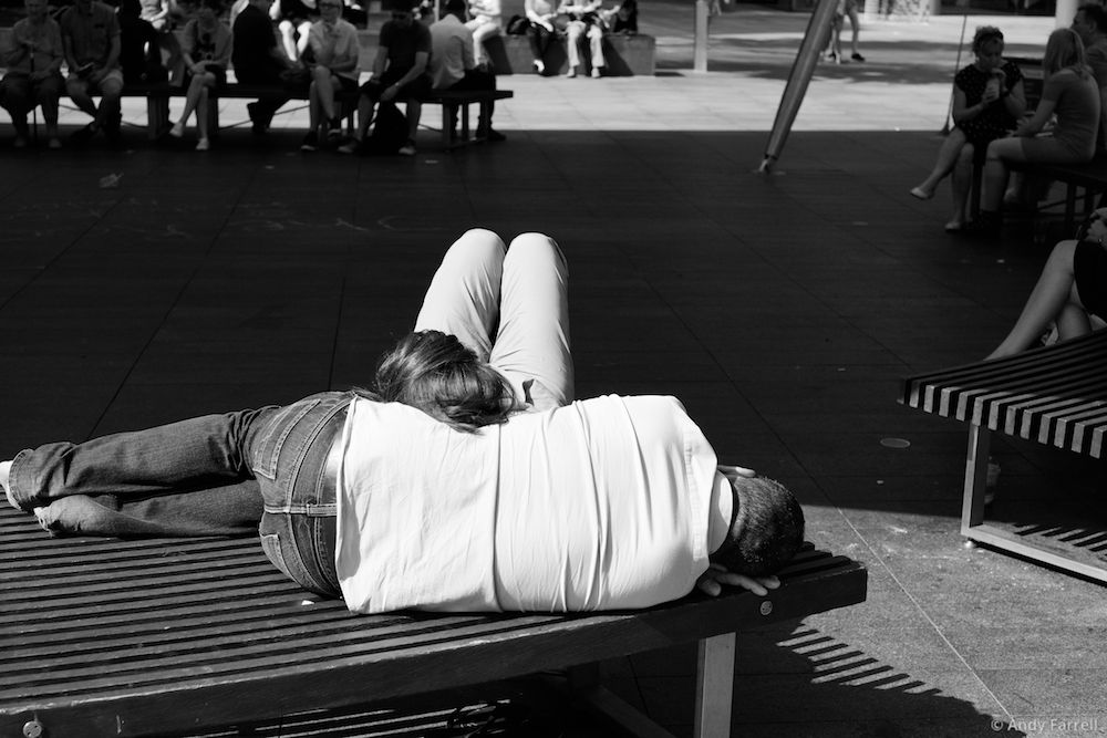 woman relaxing against a man lying down