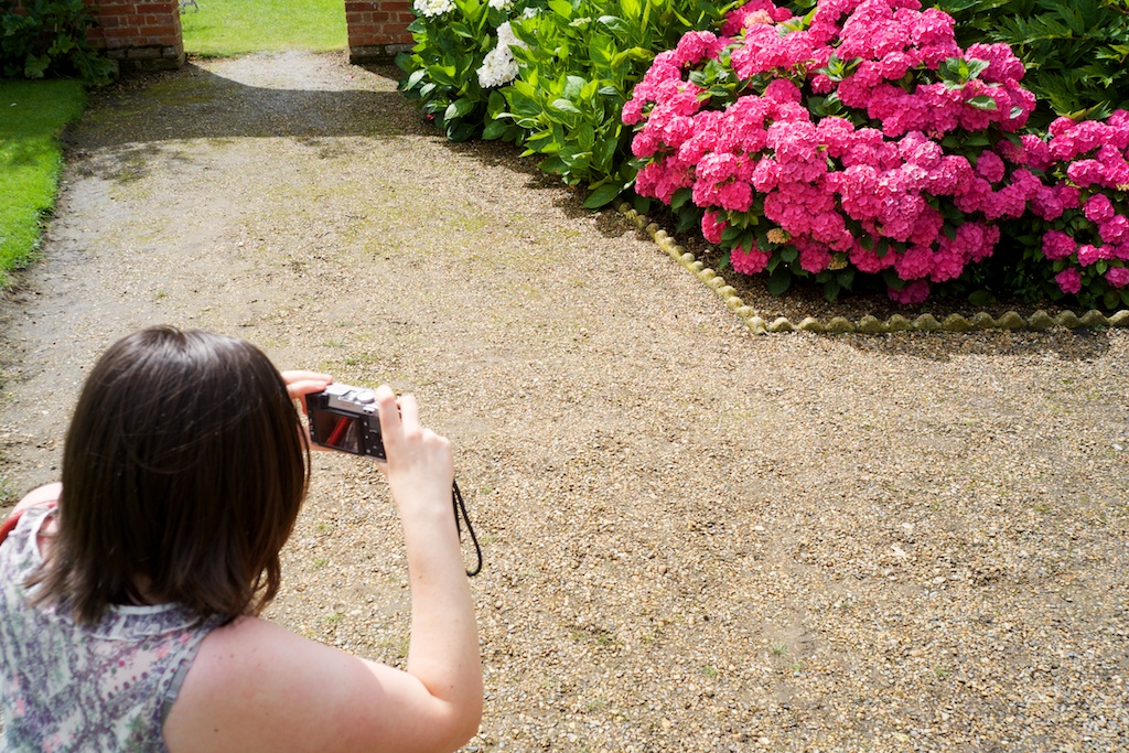 Zoe photographing flowers