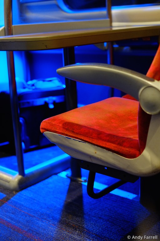 seat and luggage compartment on a Virgin train