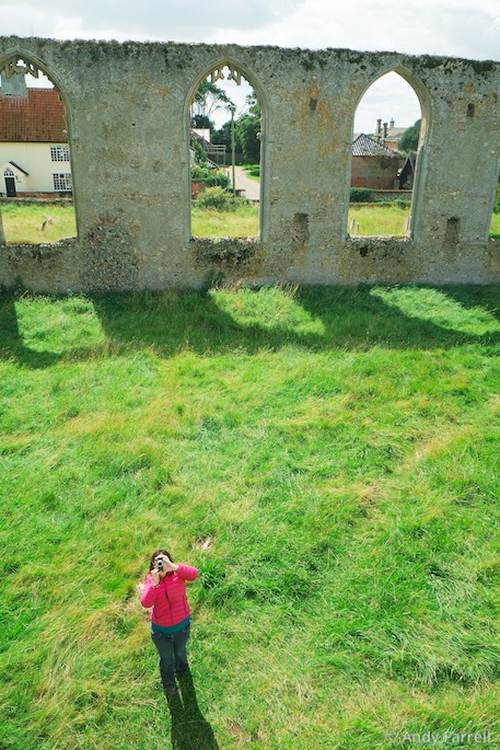 Zoe taking a picture of me on the wall