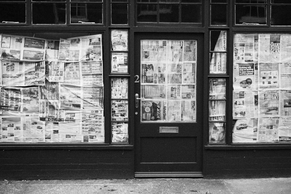 shop window covered in newspaper