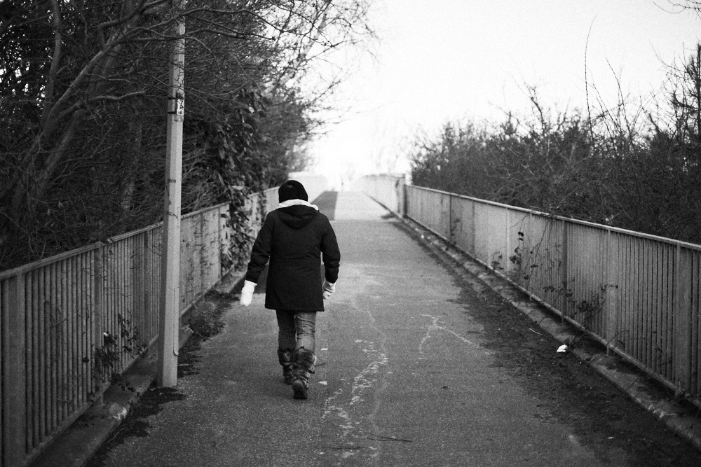 woman walking up Bloodmoor bridge