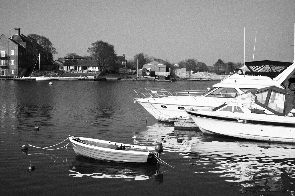 moored yachts and dinghy