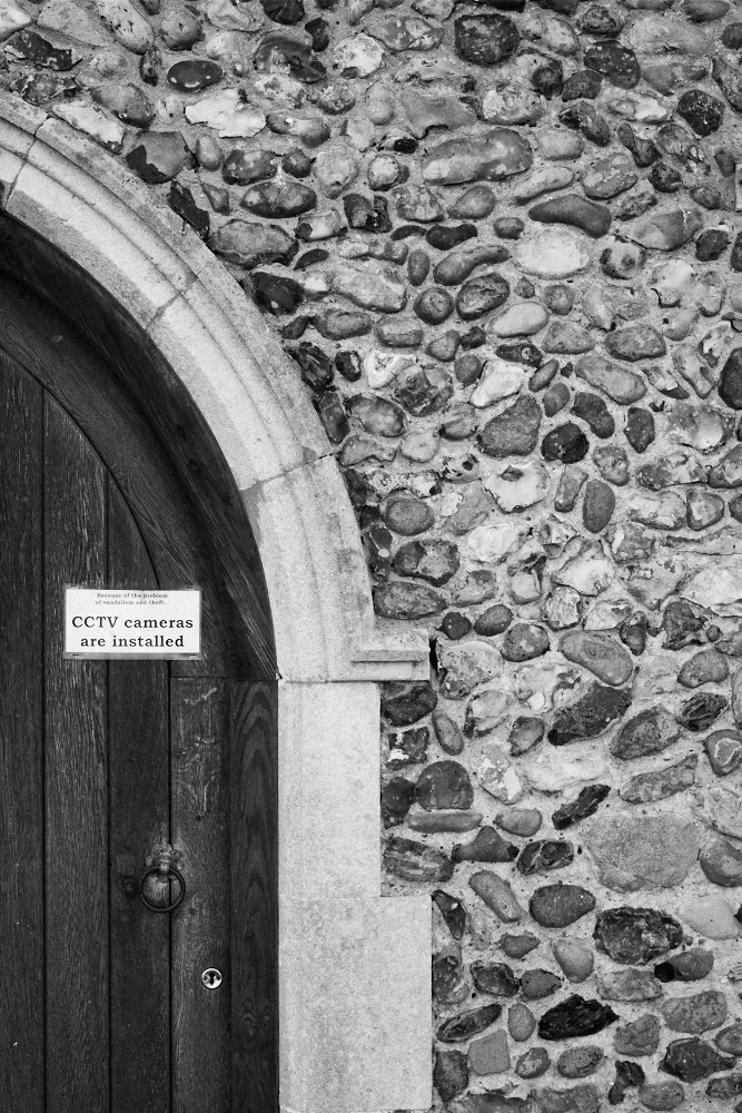 CCTV sign on church door