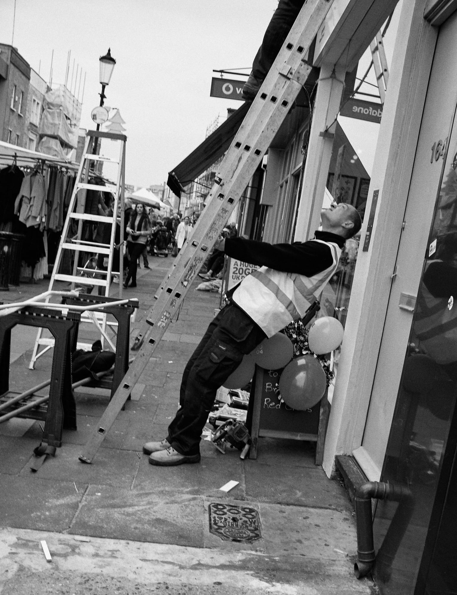 worker bracing ladder