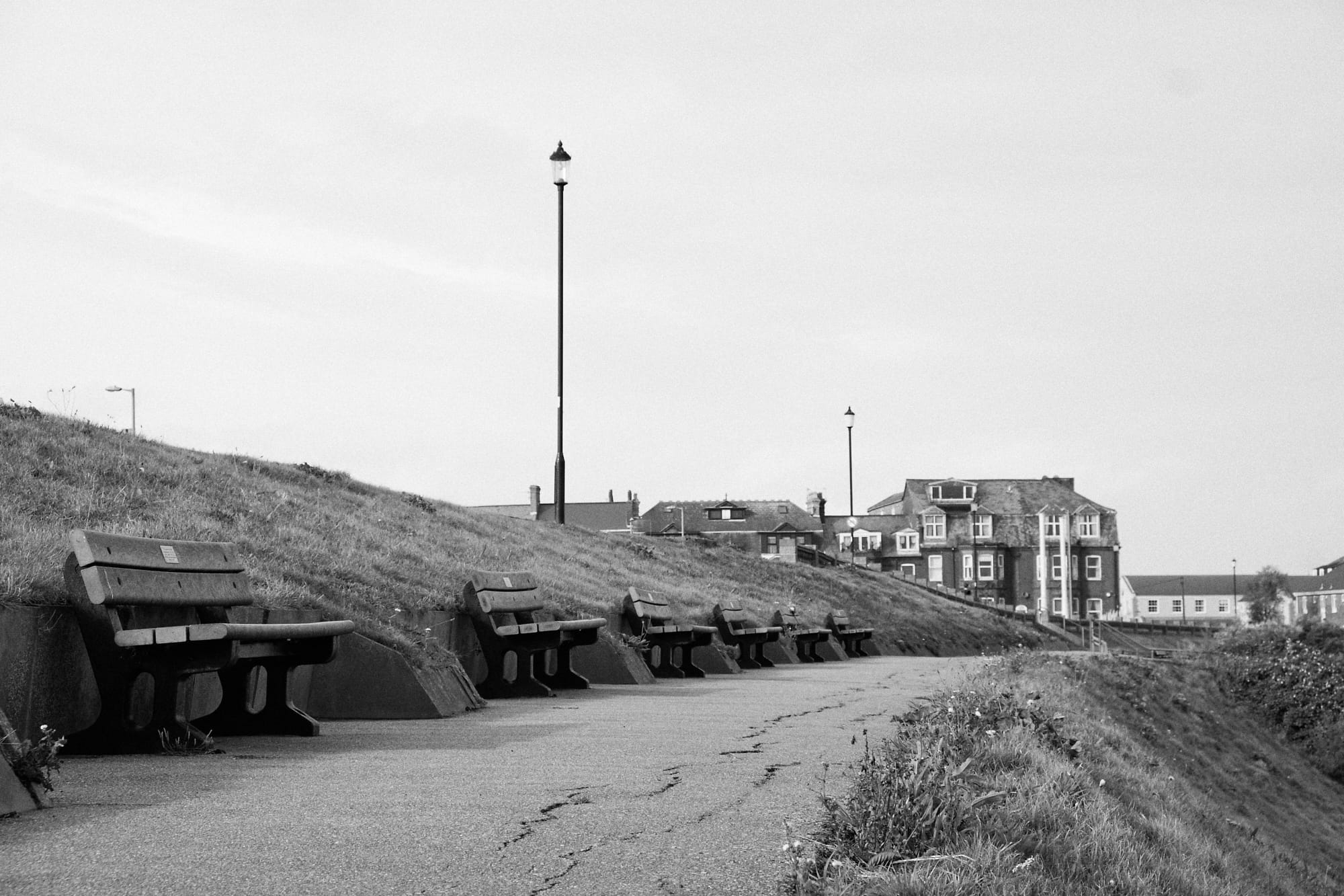 upper level promenade benches facing out to sea