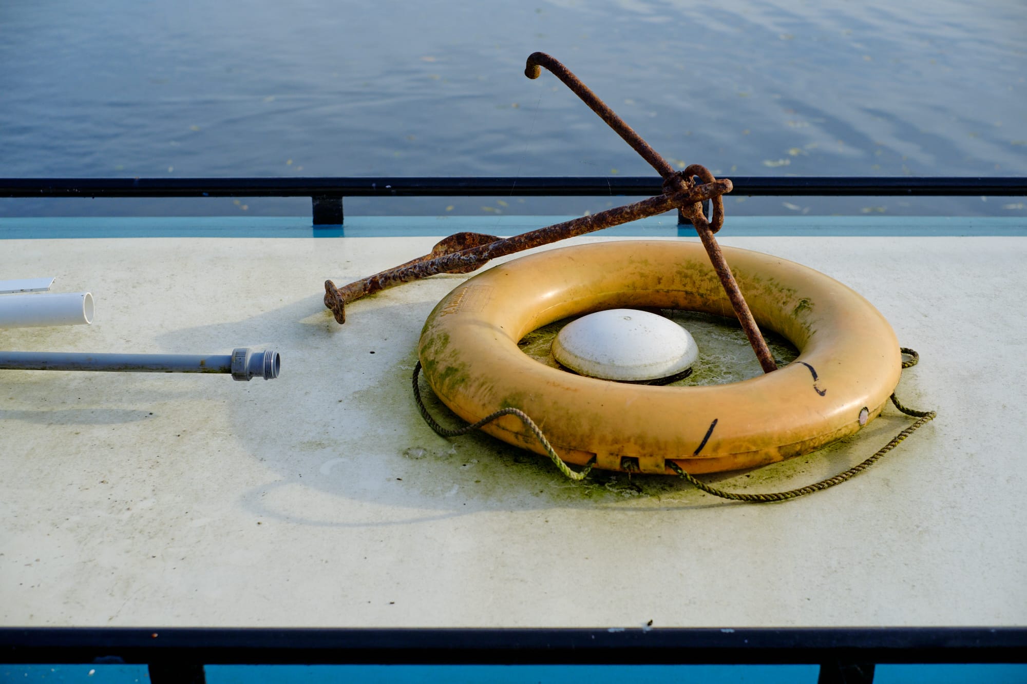 anchor and life buoy on top of riverboat
