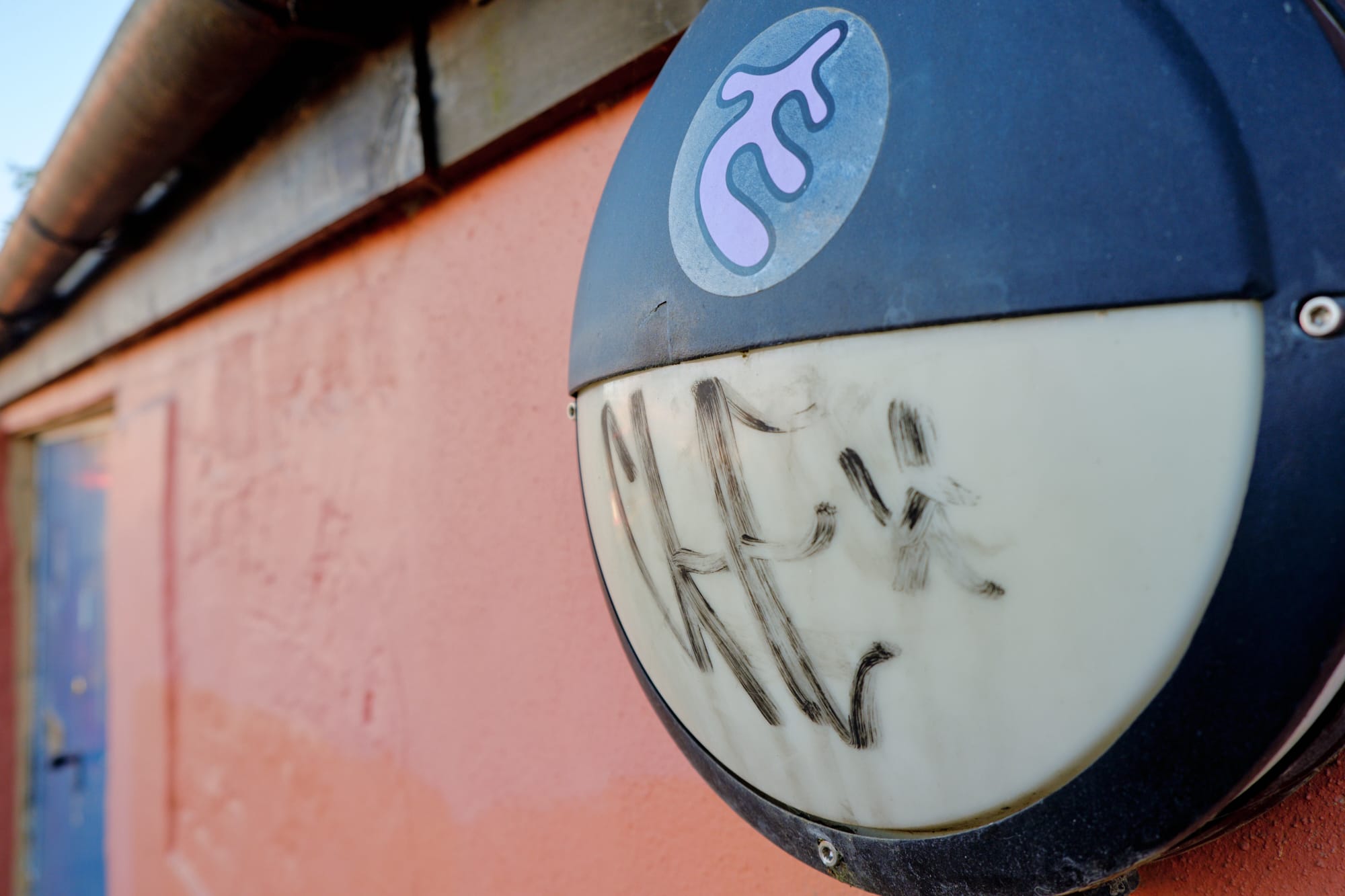 graffiti on pedestrian street light