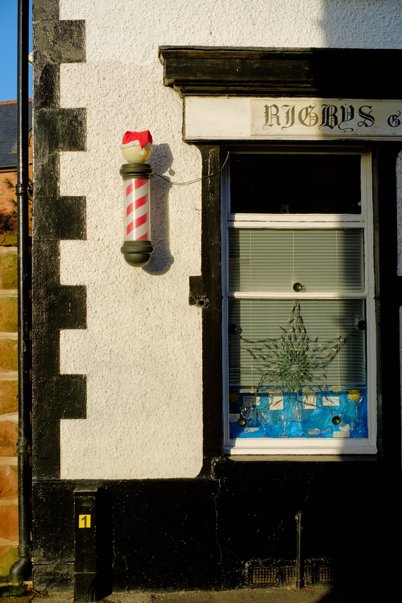 barber pole with Santa hat