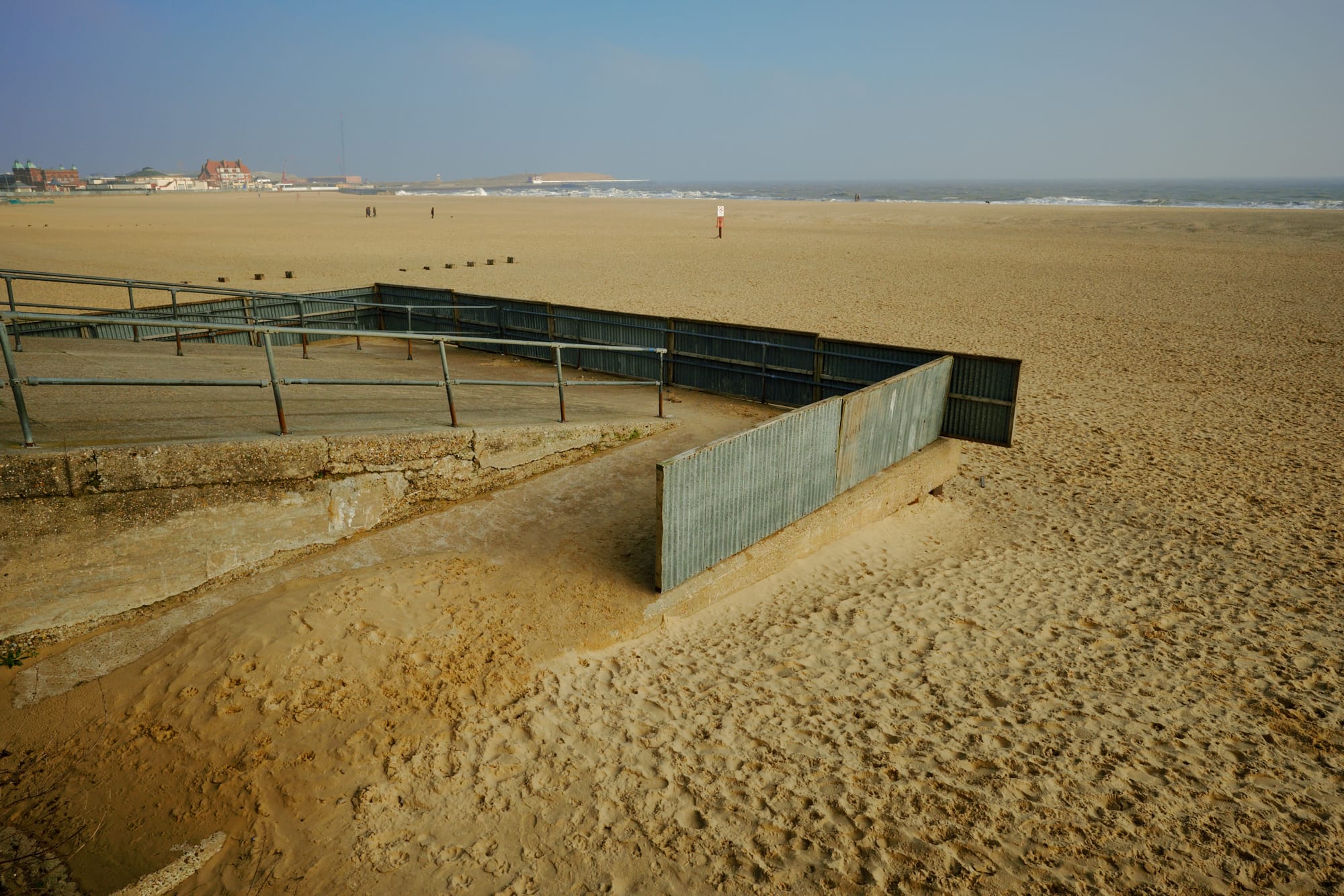 corrugated metal sheeting attached to railings on the beach