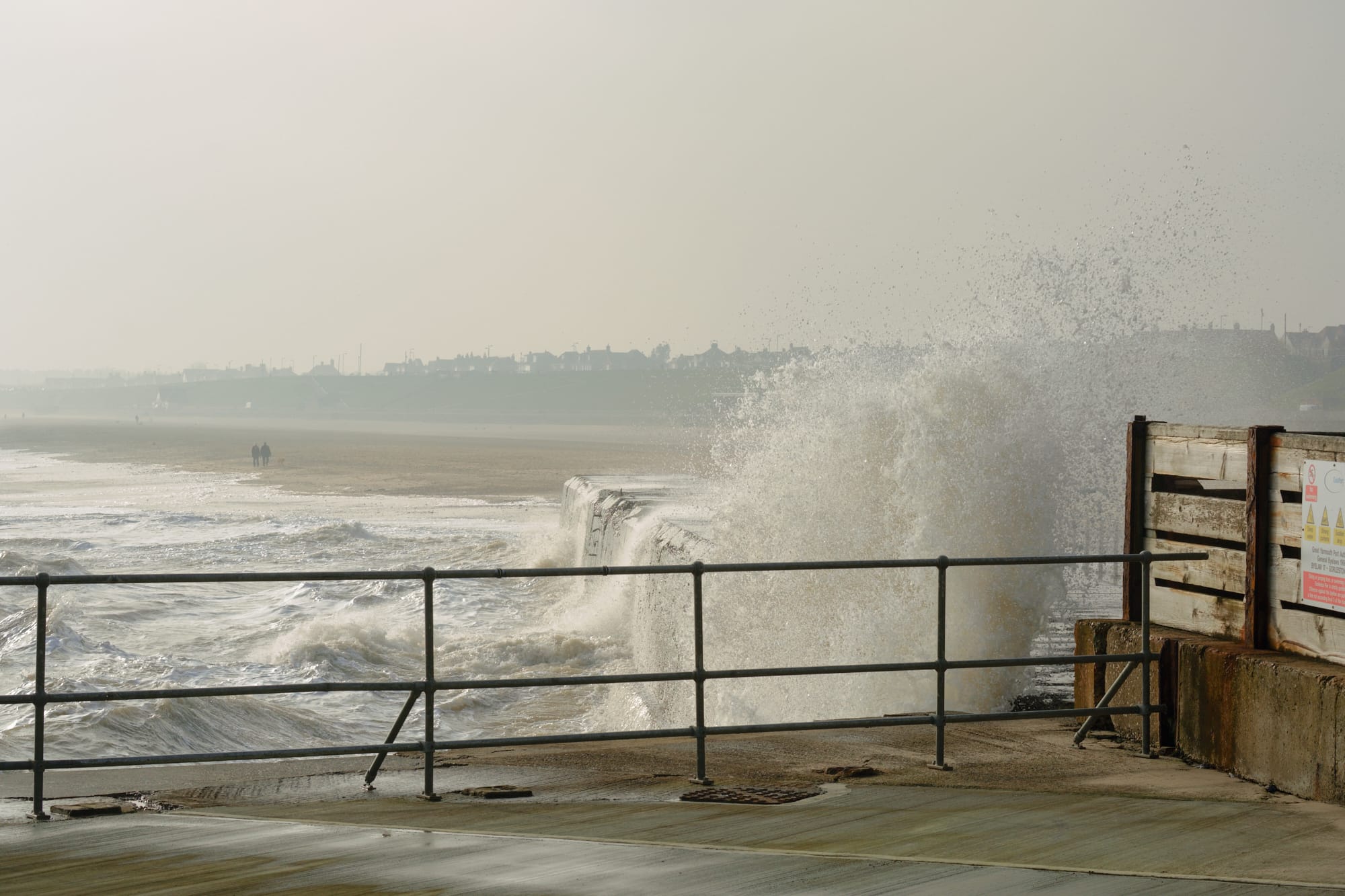 waves crashing into the sea wall