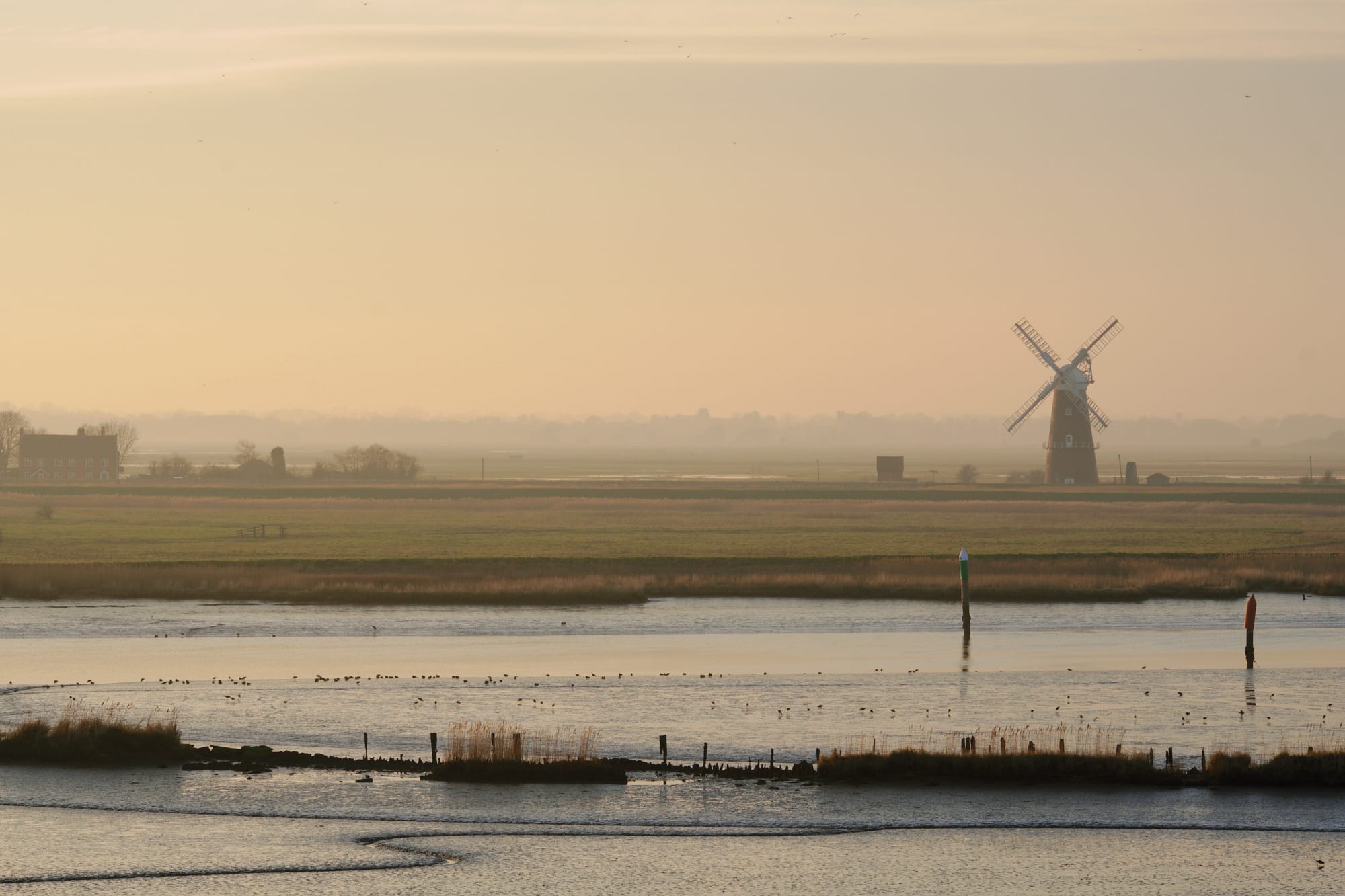 a windmill in the distance to the west