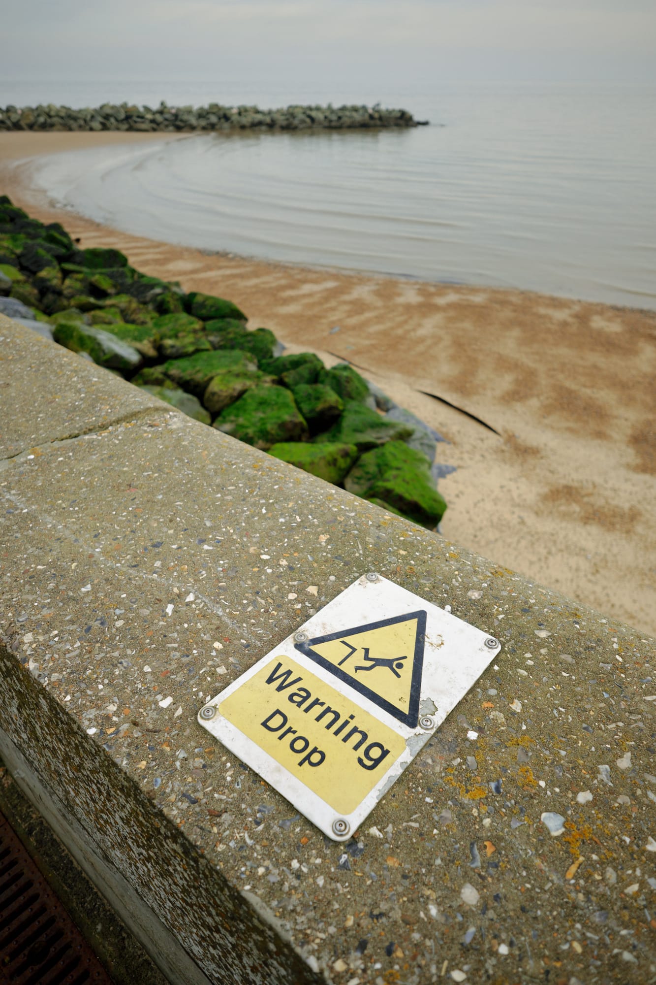 ‘Warning Drop’ sign on sea wall
