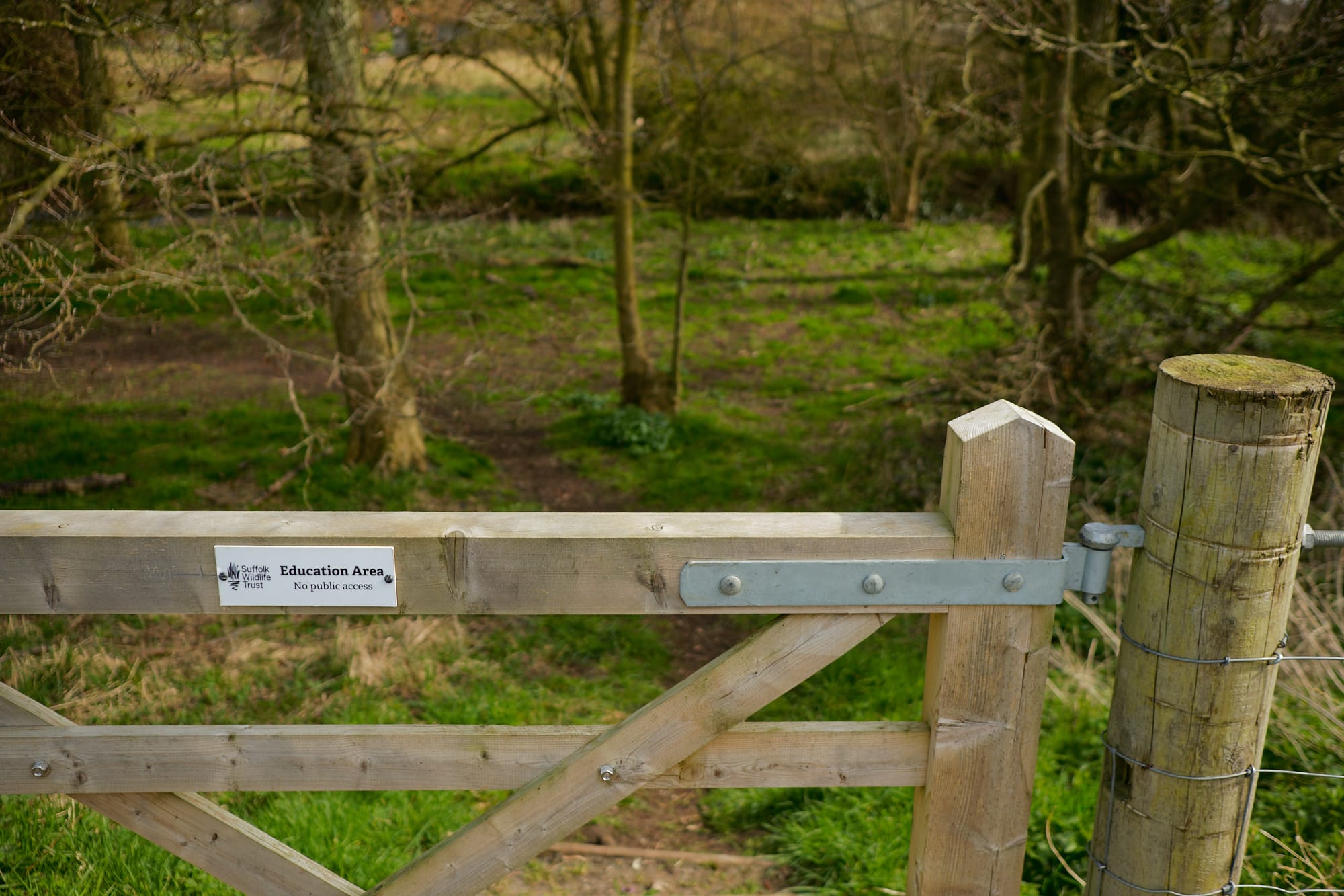 gate with ‘Education Area’ sign on it