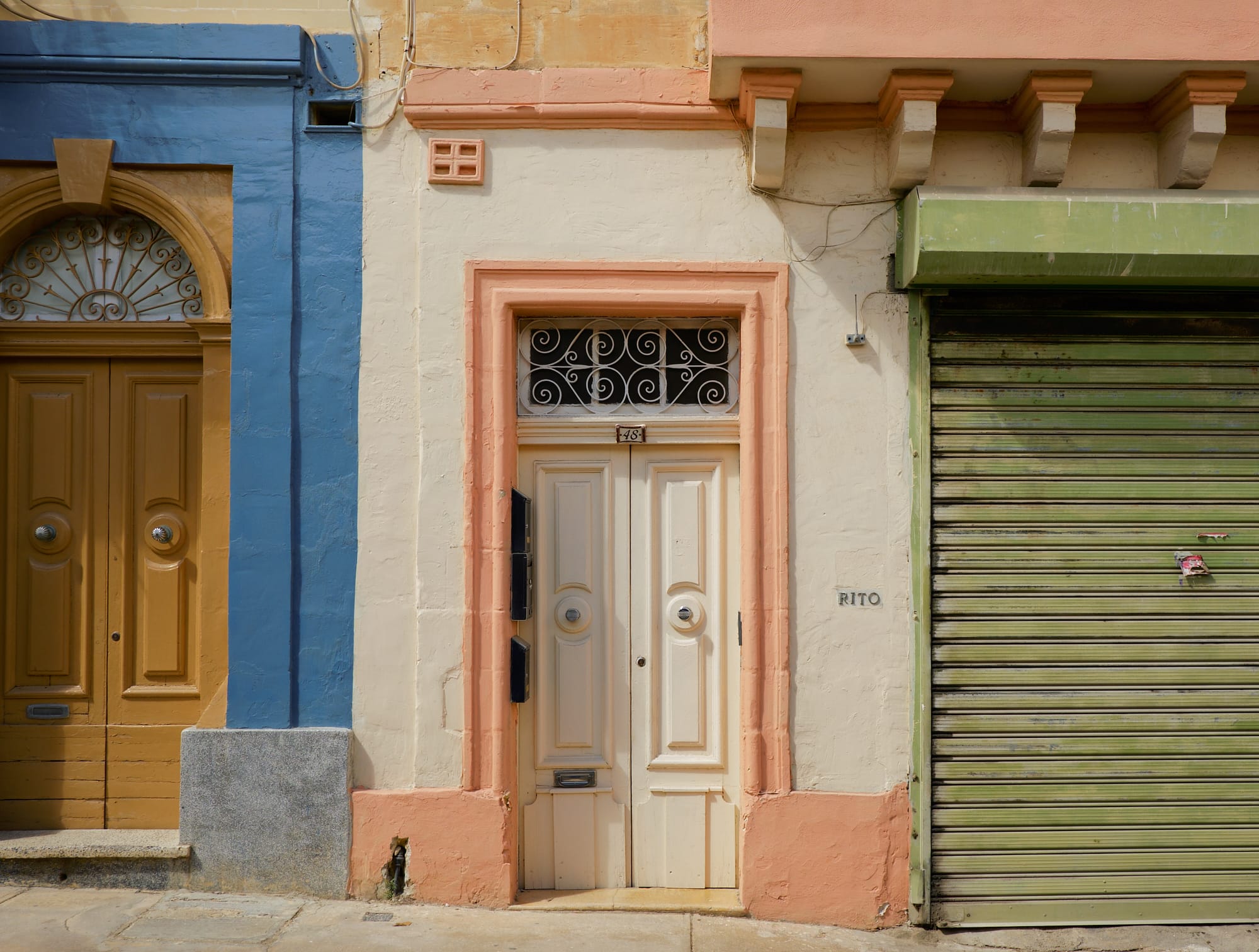 building with three pastel primary paint colours