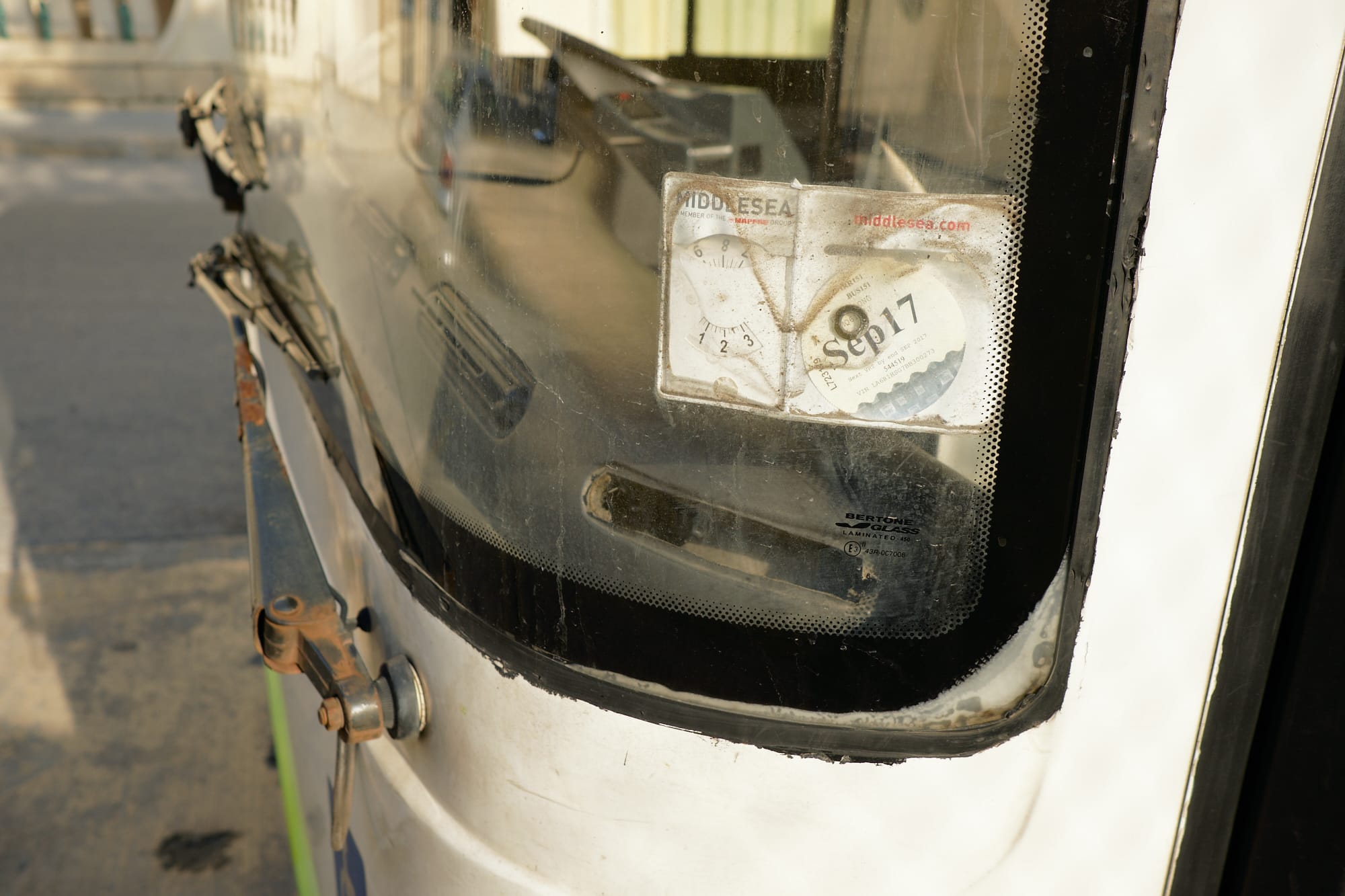 tax documents behind bus windscreen