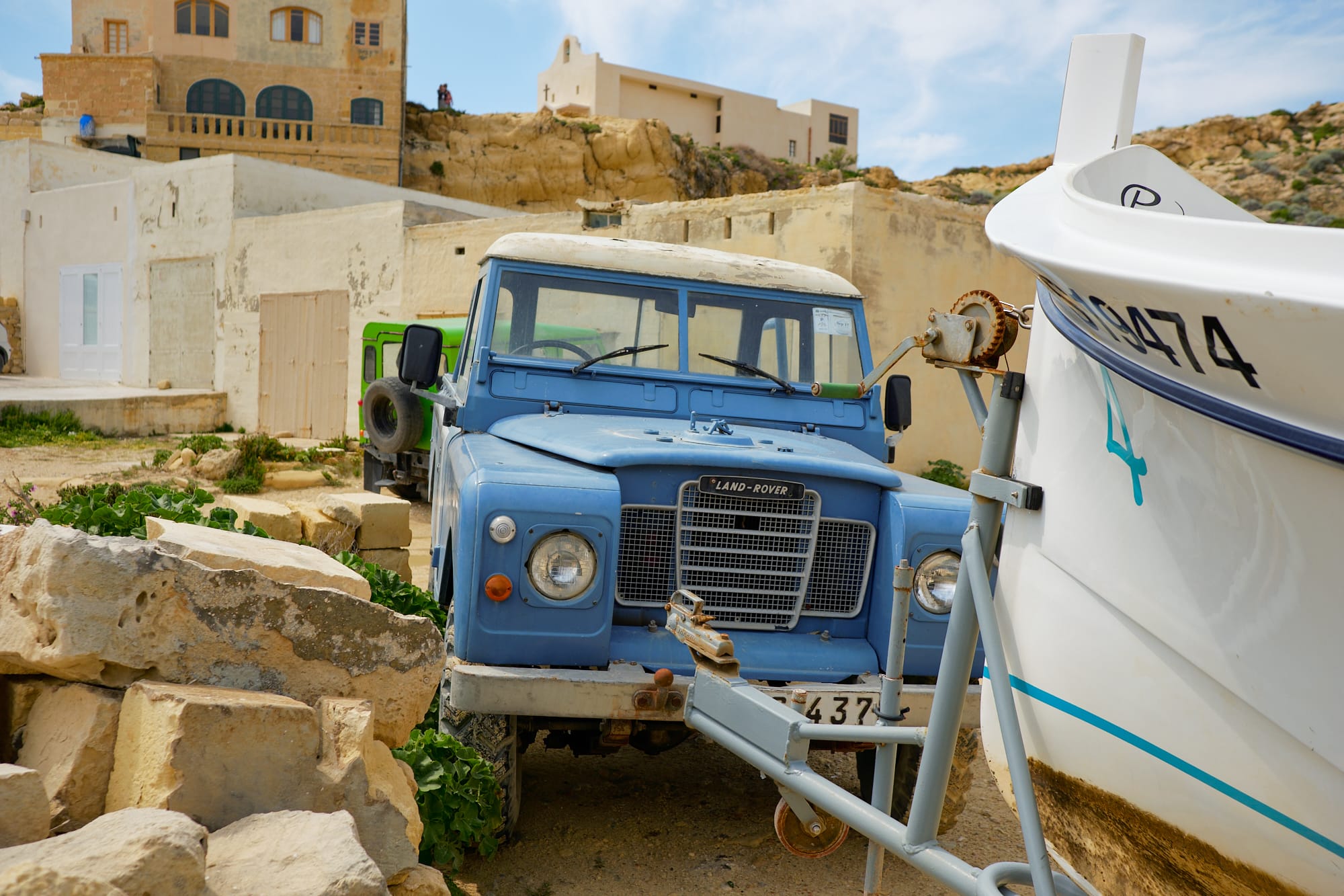 Landrover parked by a boat