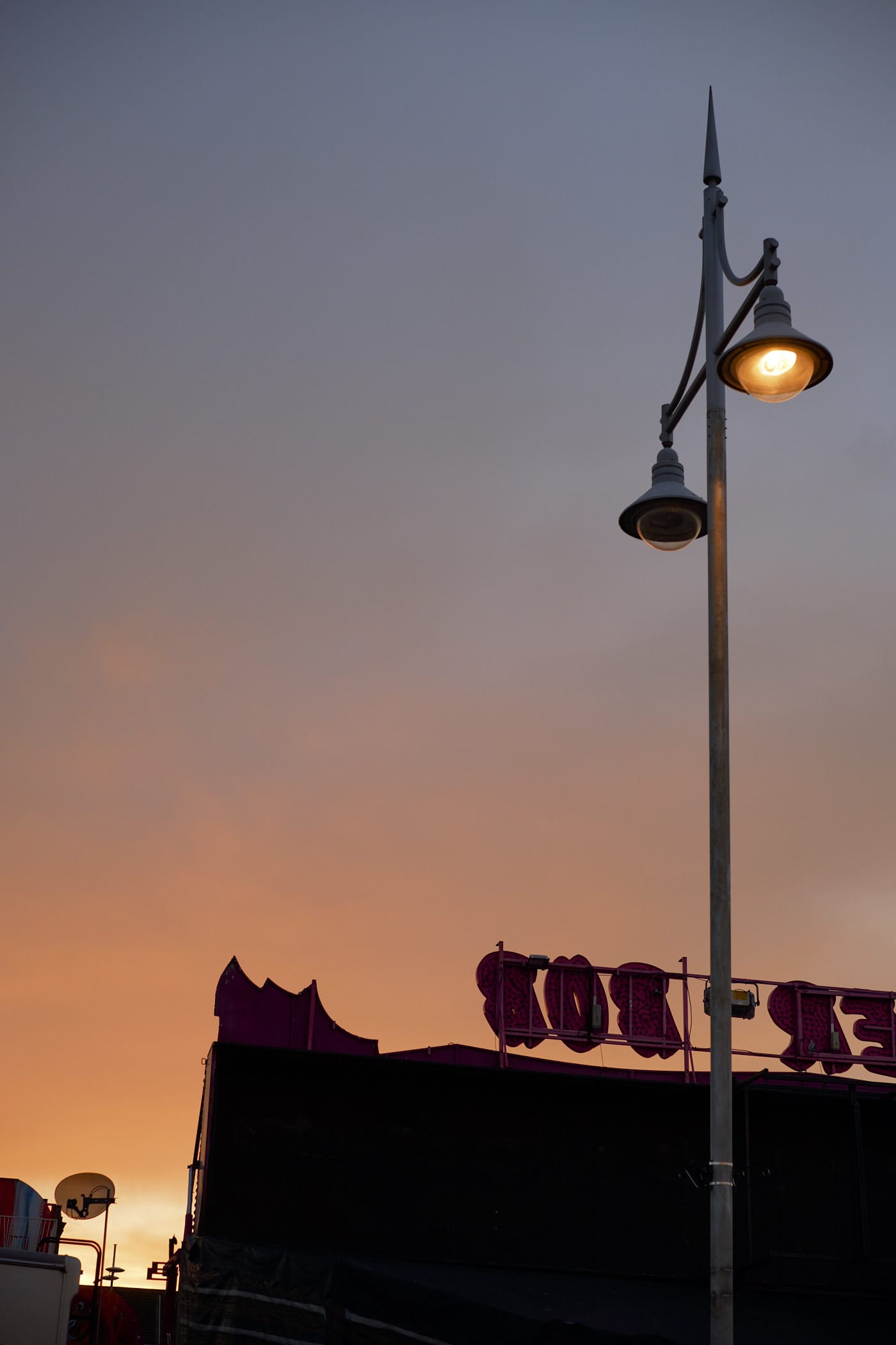 lit lamp and sunset sky