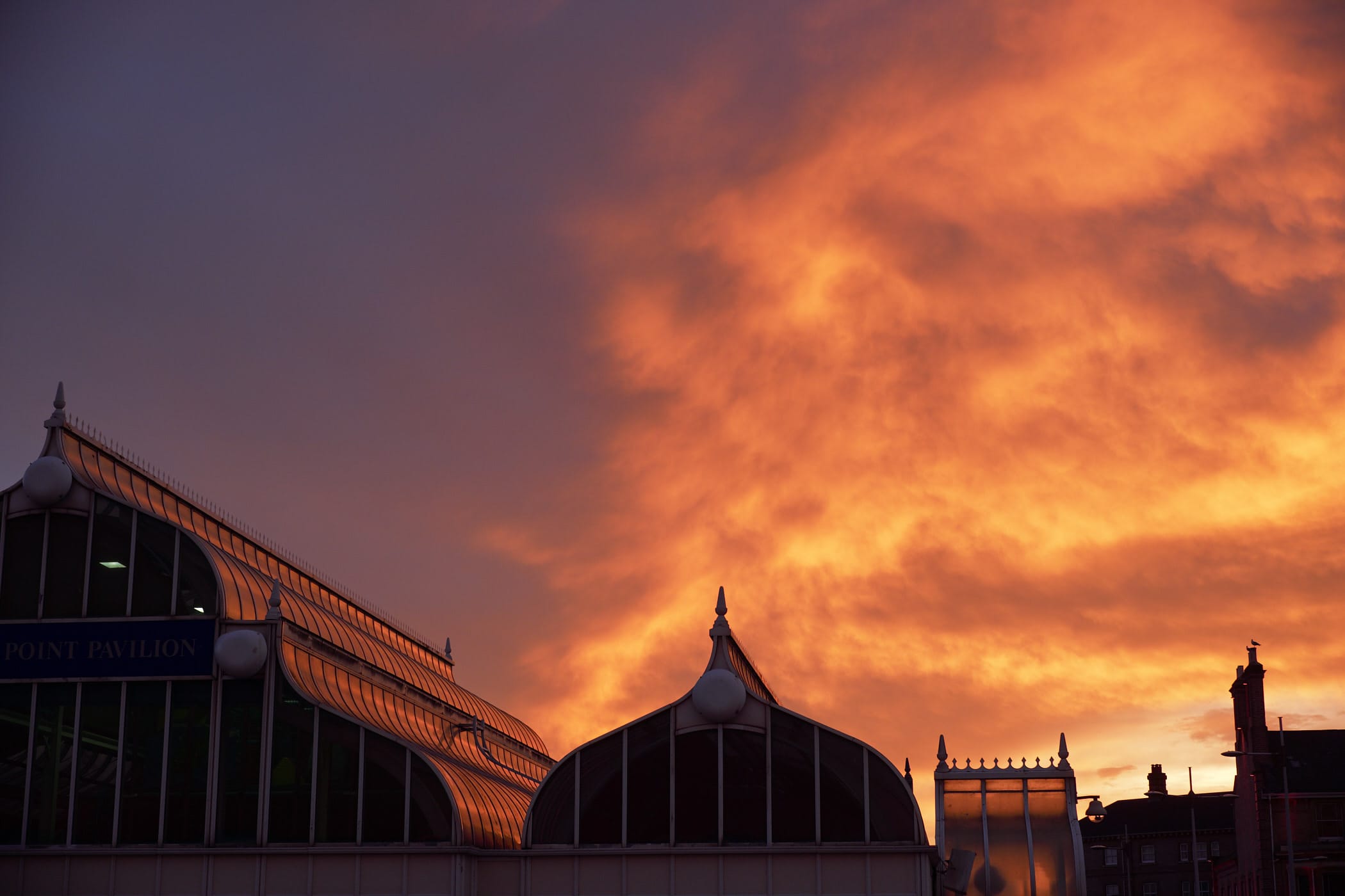 sunset sky reflected on glass roof