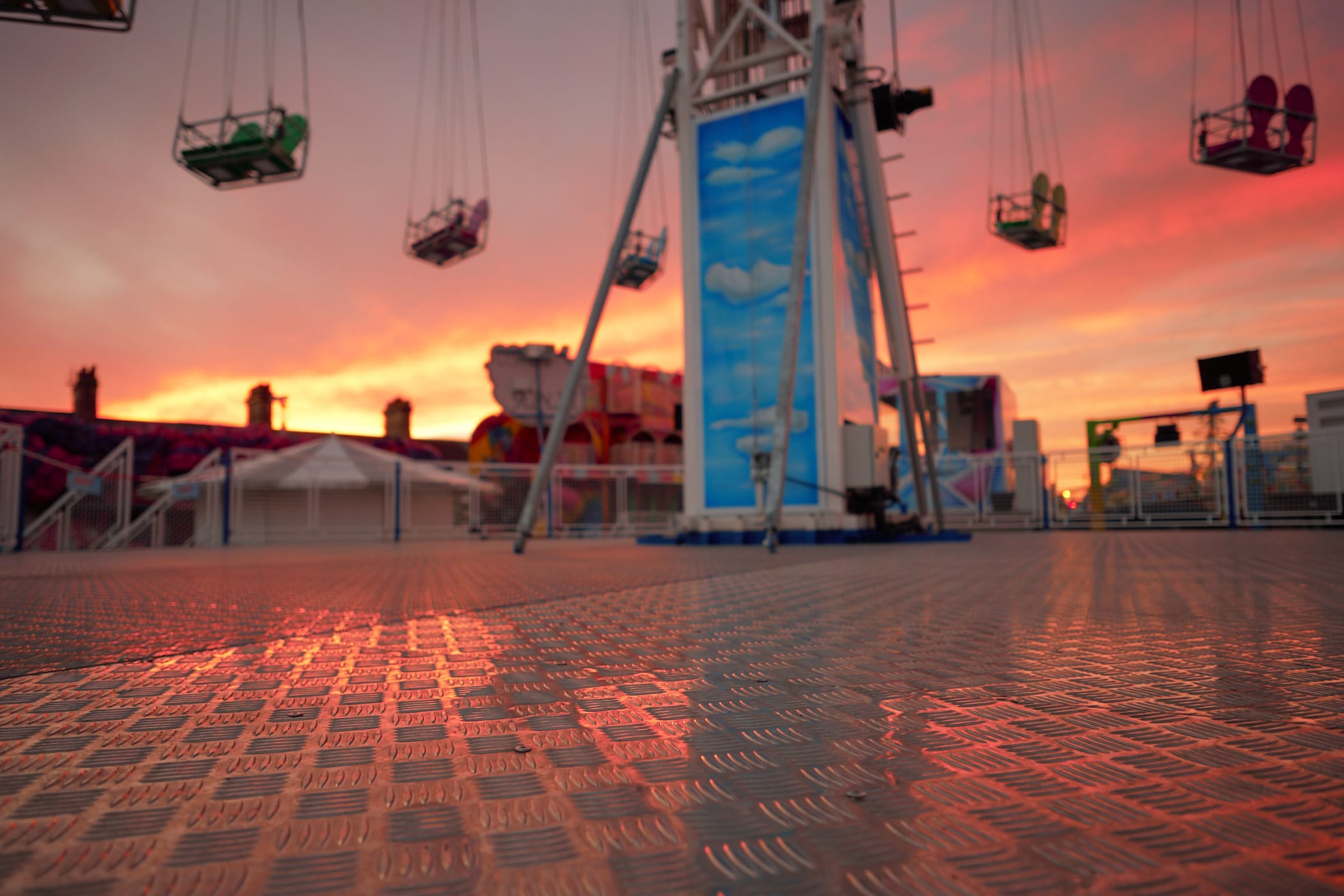 sunset sky reflected on ride floor