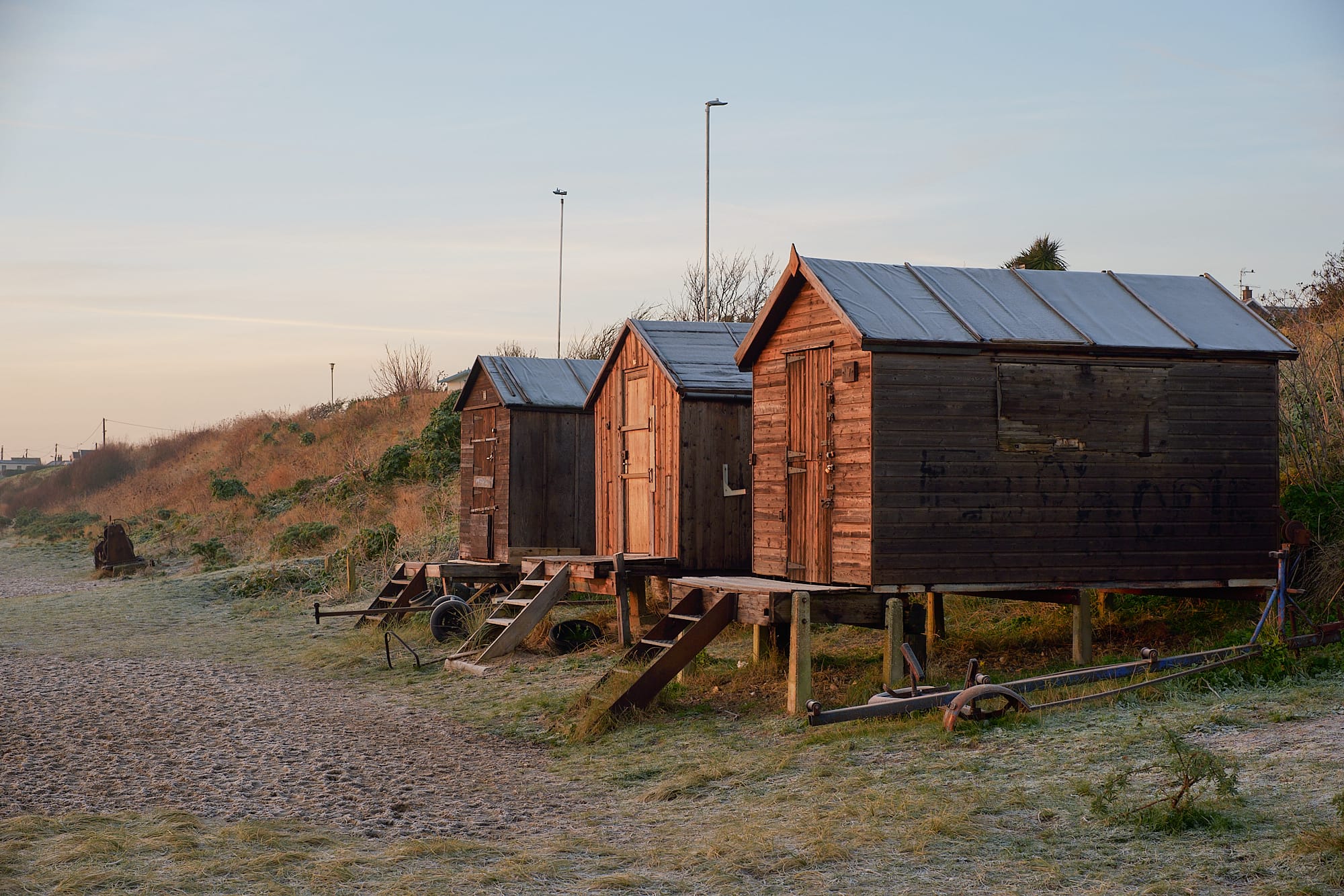 beach huts at dawn