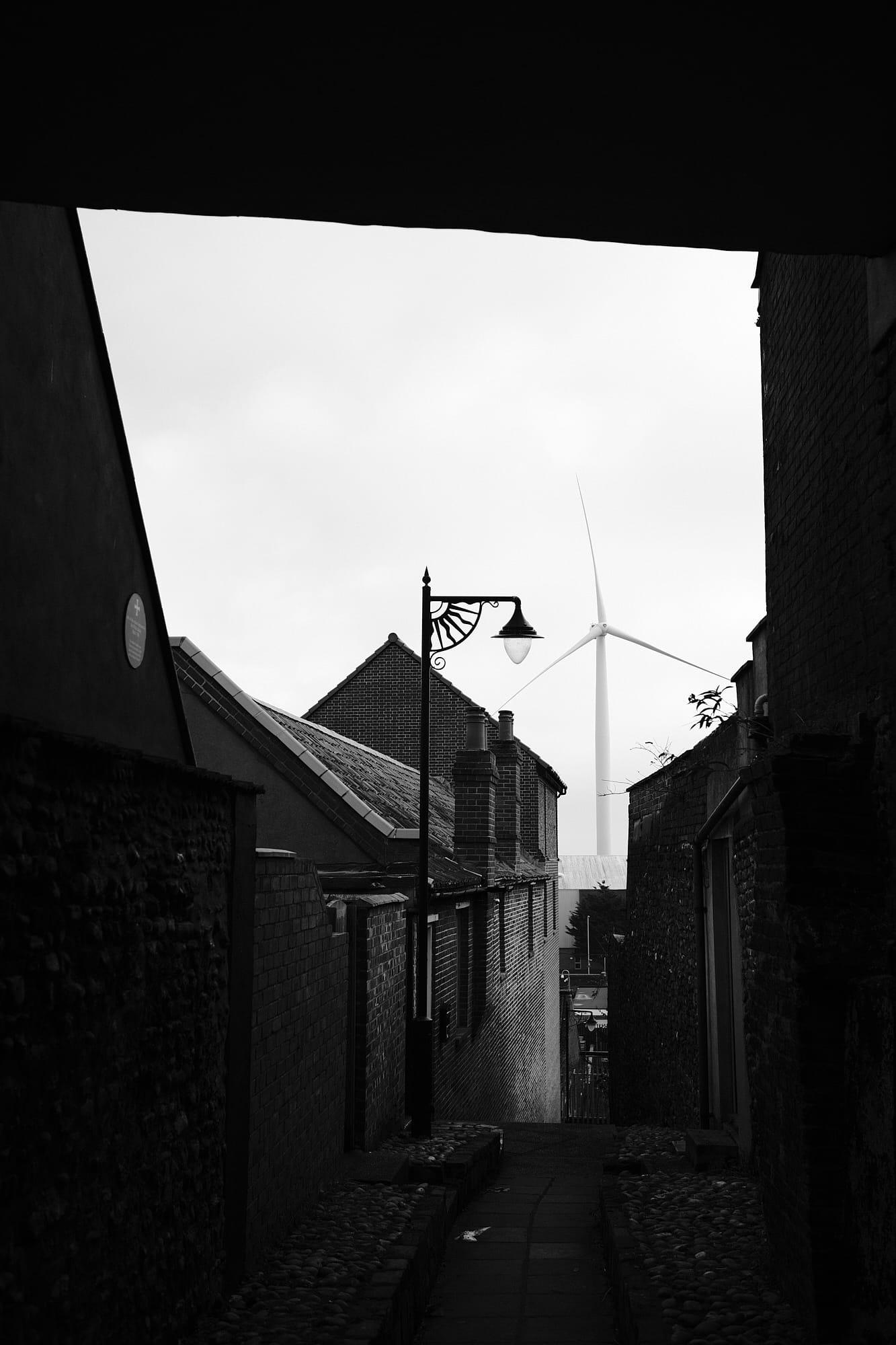 road down to the seafront and wind turbine