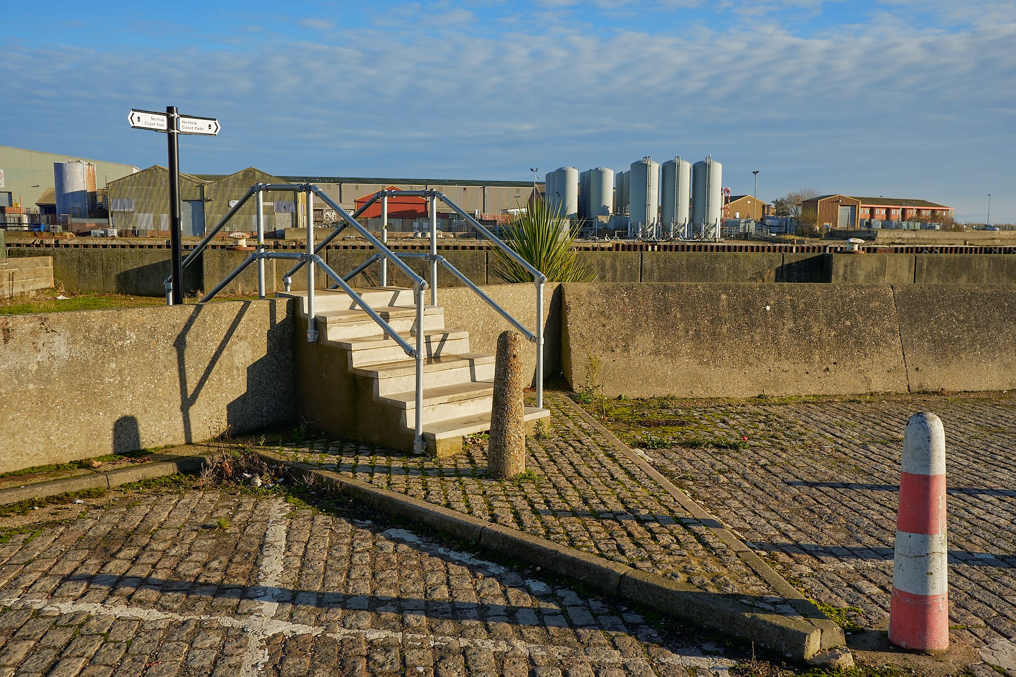 steps and bollards in cobbled carpark