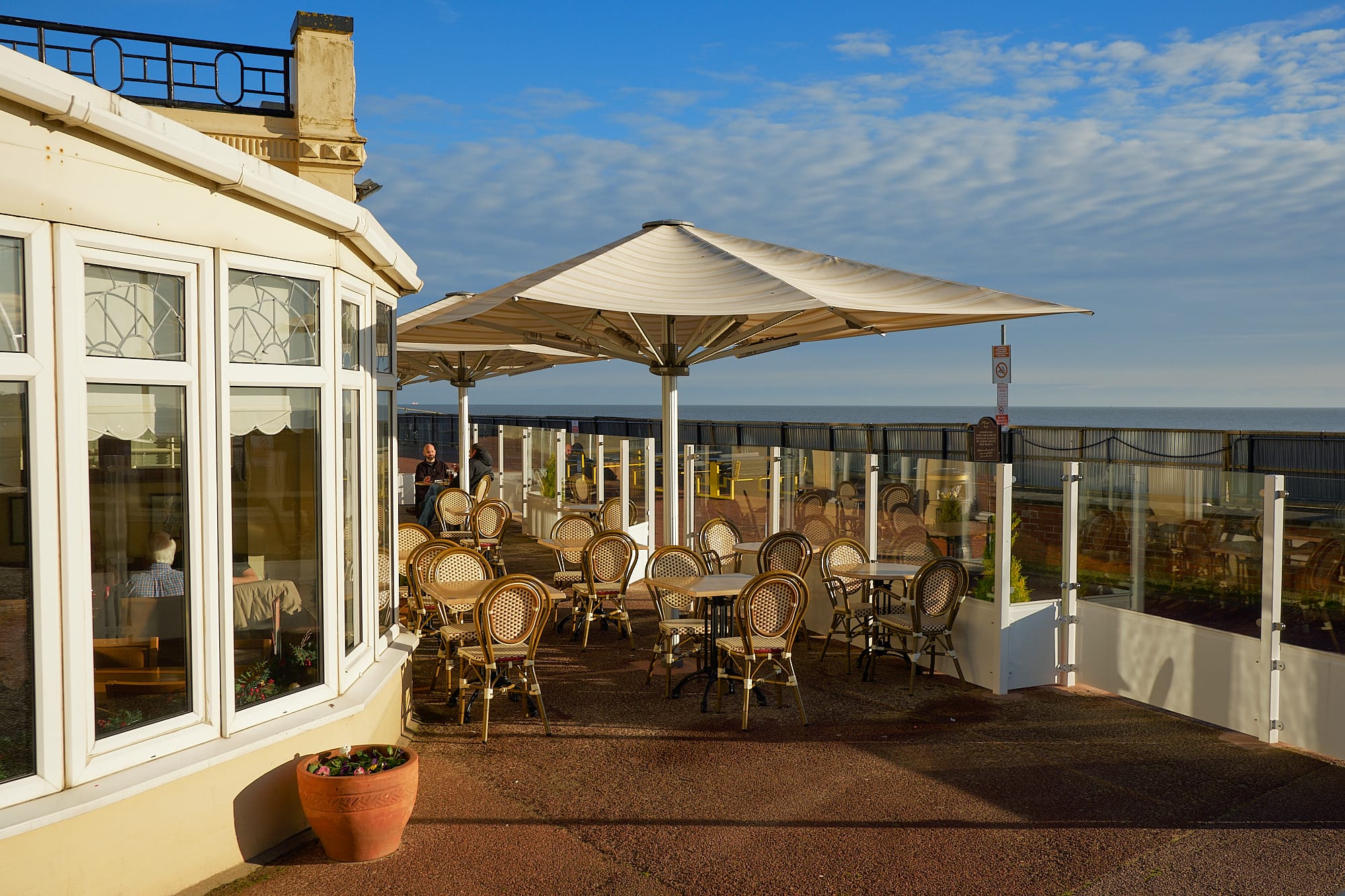 outdoor seating at a seafront restaurant