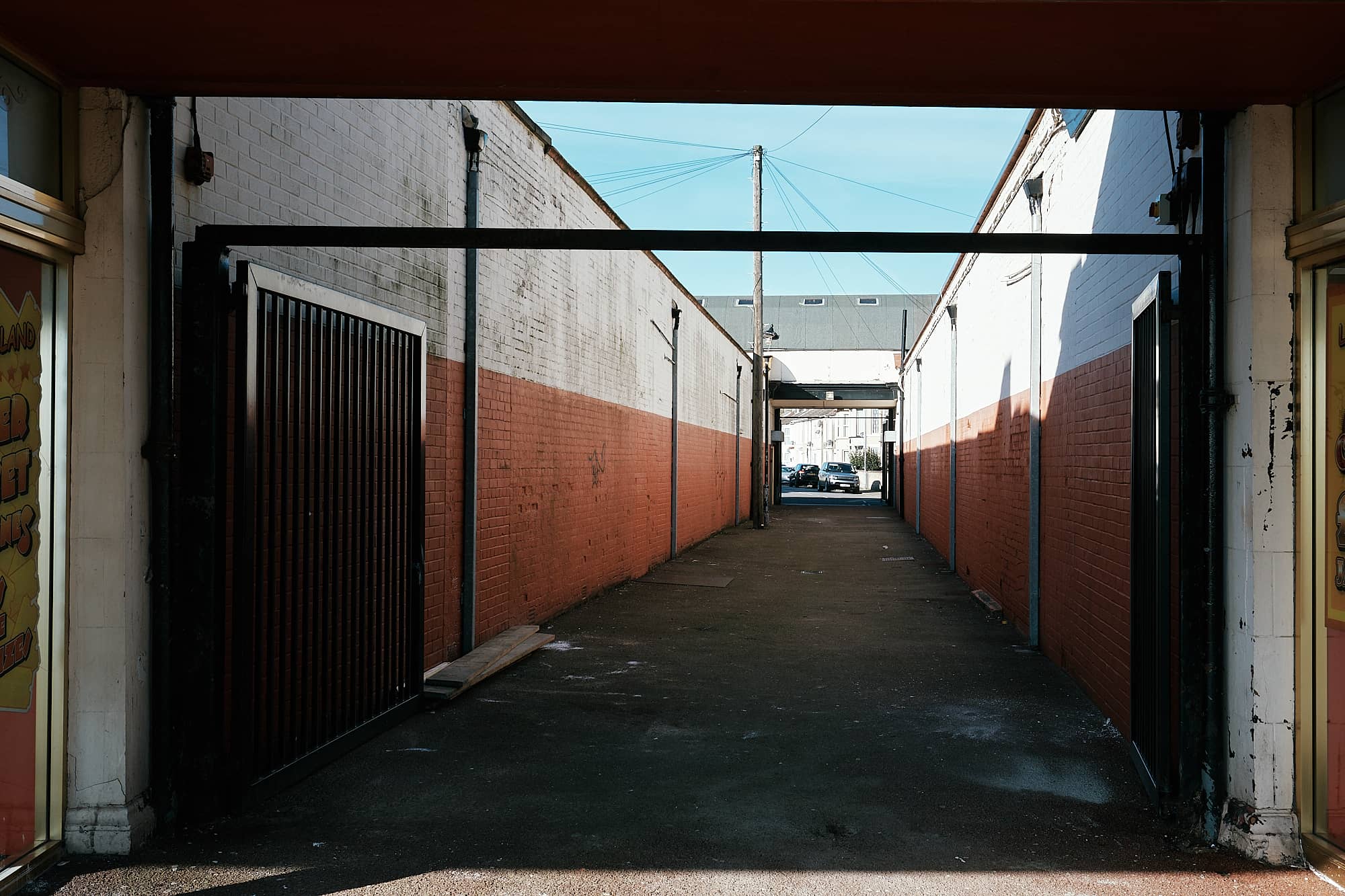 shaded alleyway with garages