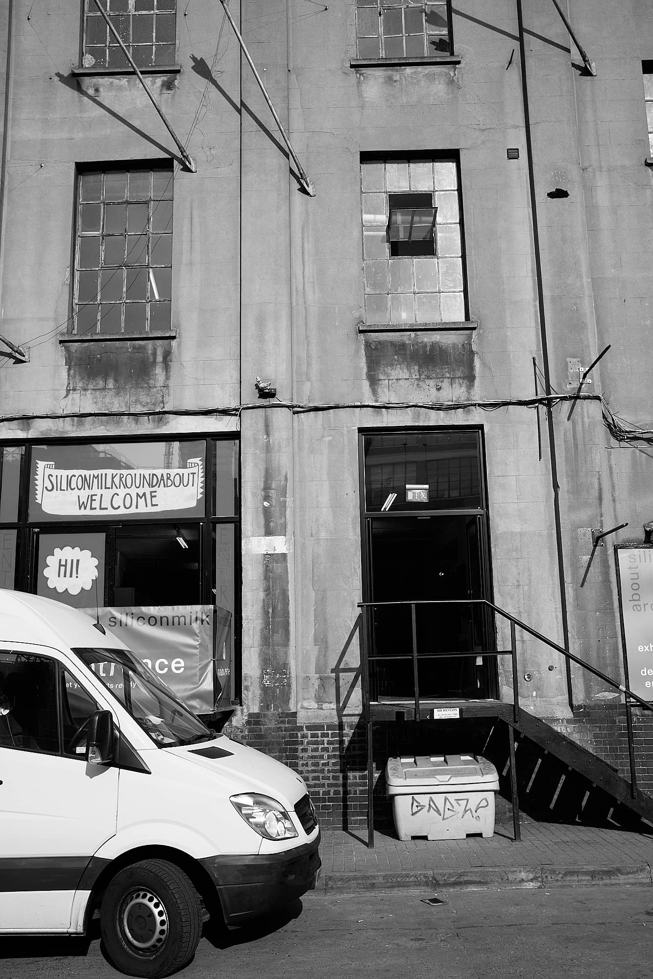 van outside converted factory building