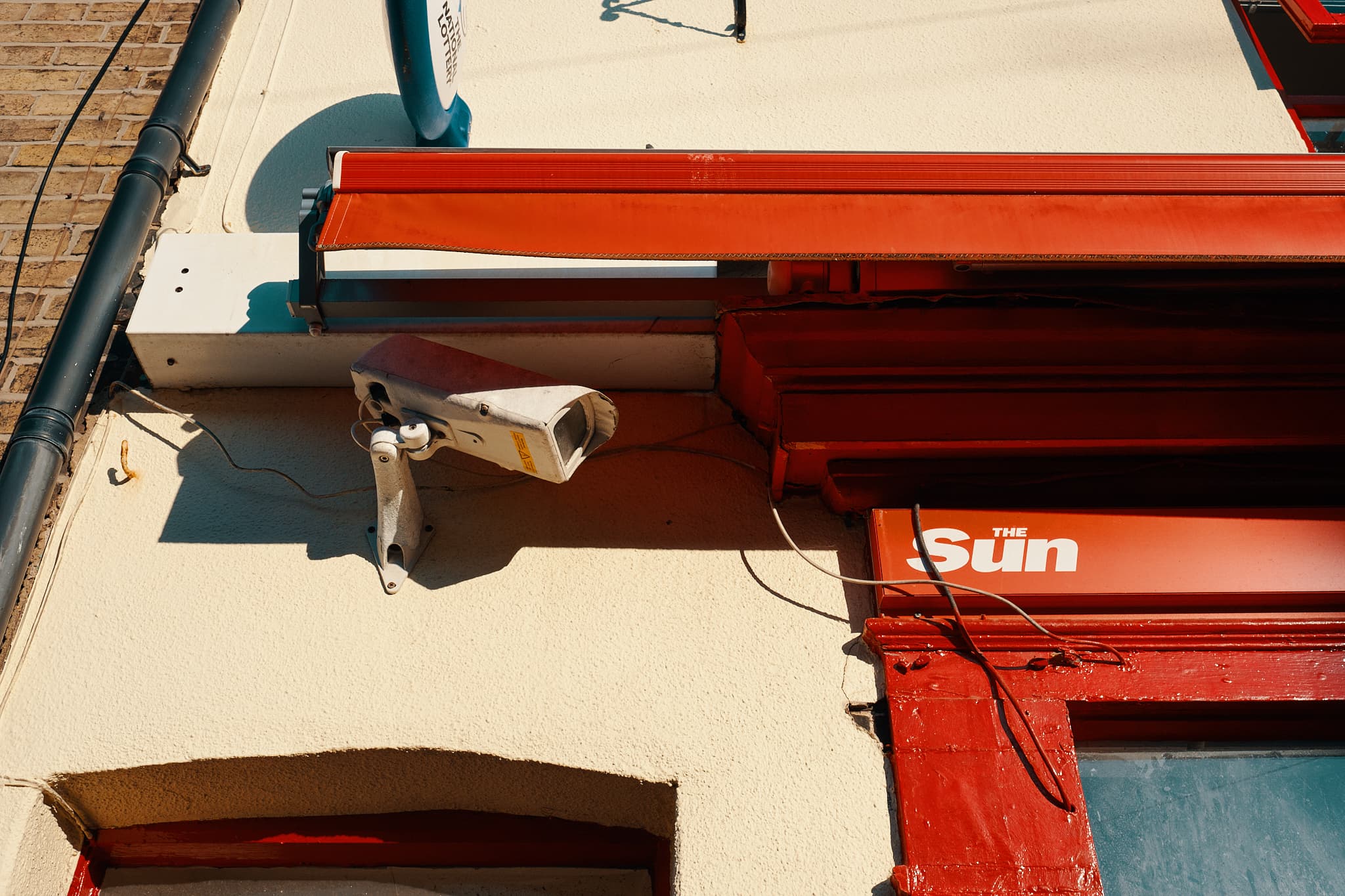 CCTV camera on the front of a newsagent