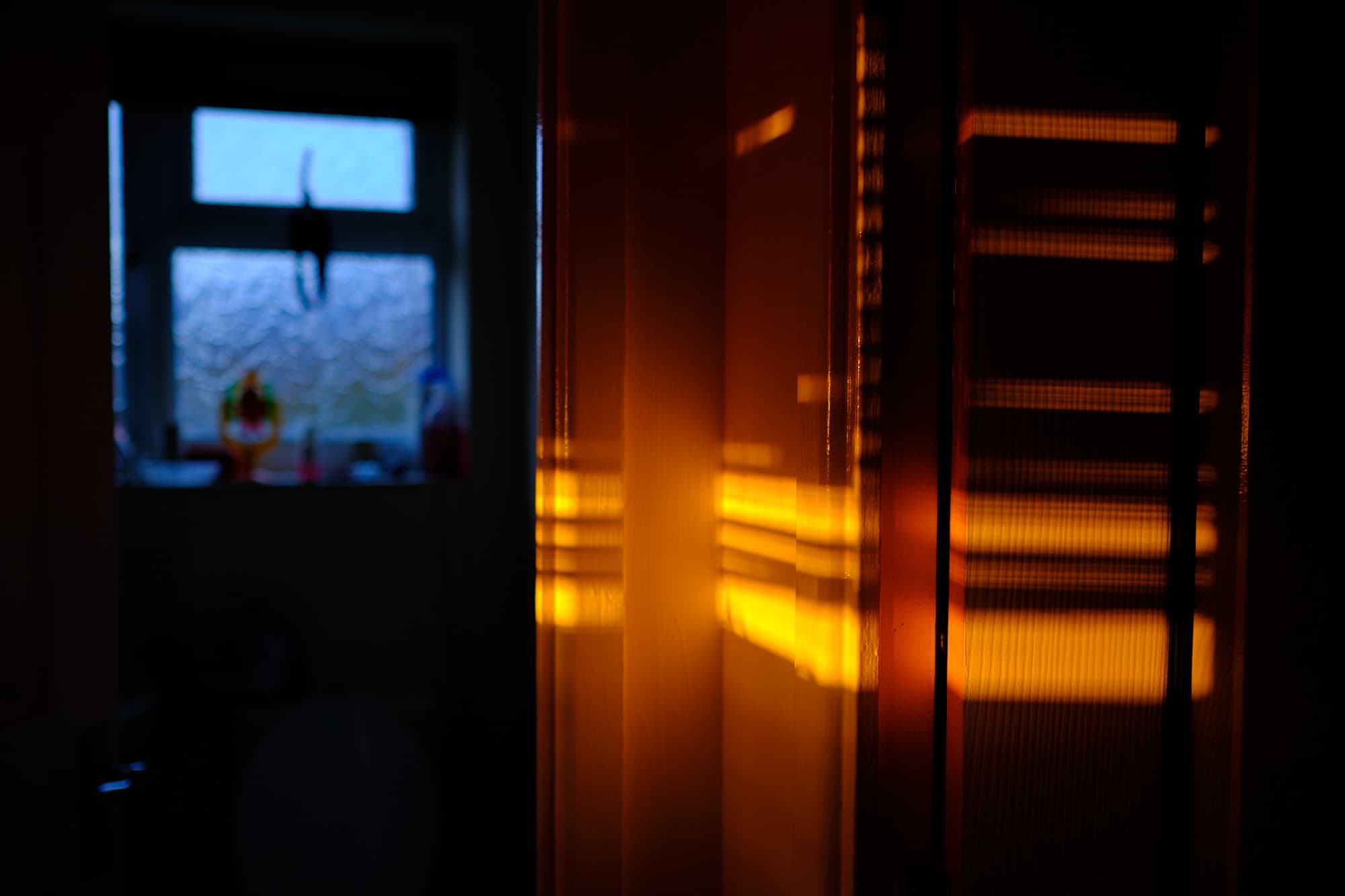 evening sun shining through blinds