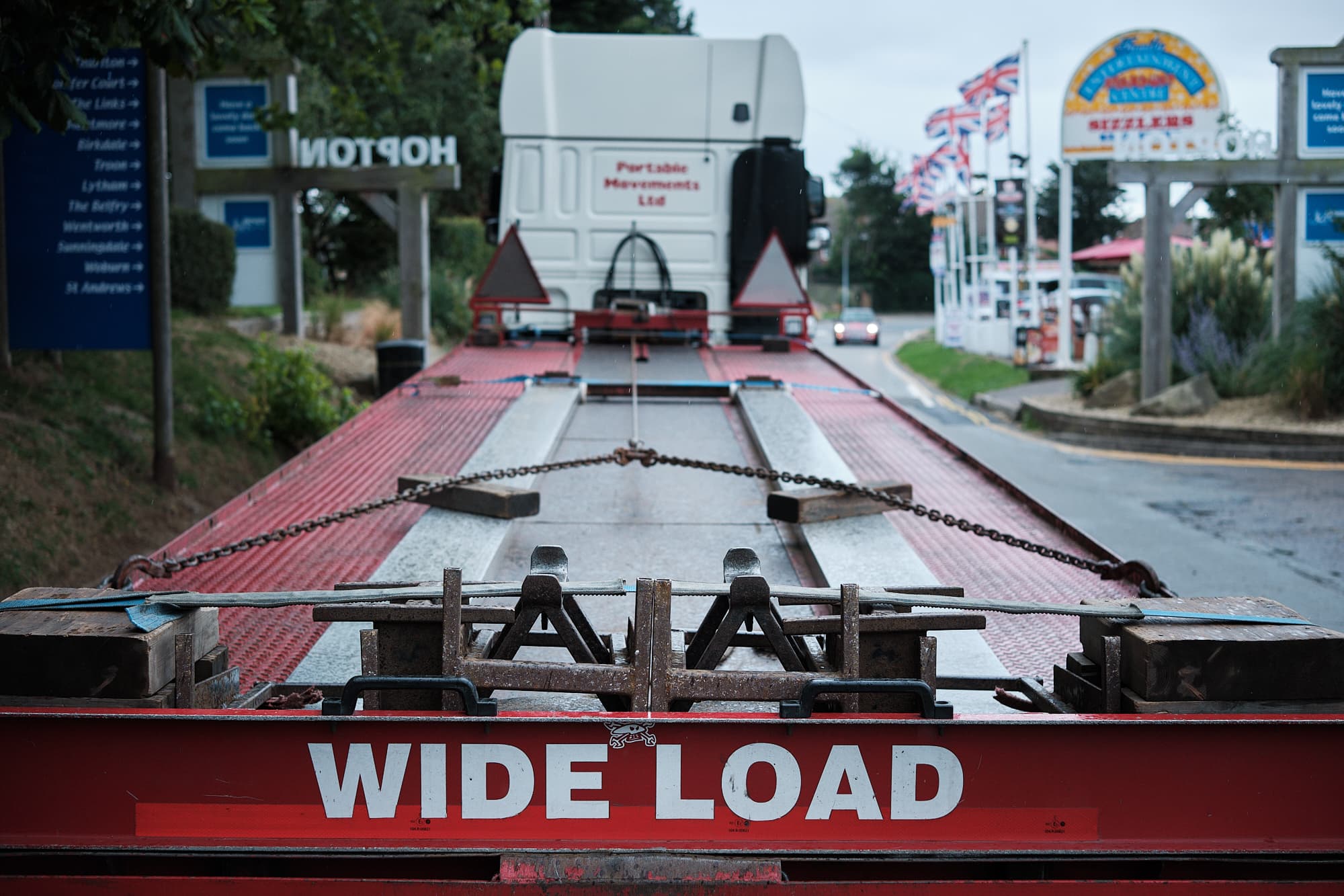 mobile home delivery truck leaving Hopton holiday village