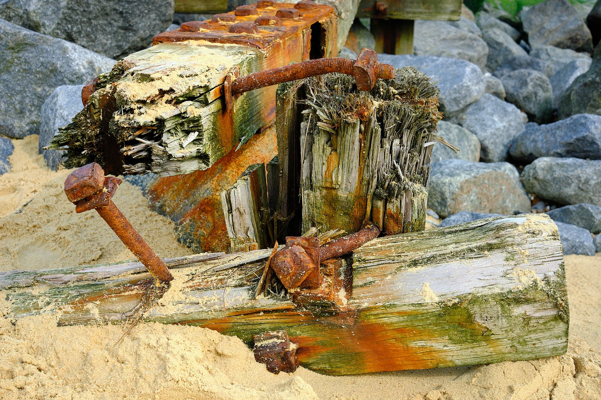 weathered groyne beams and bolts