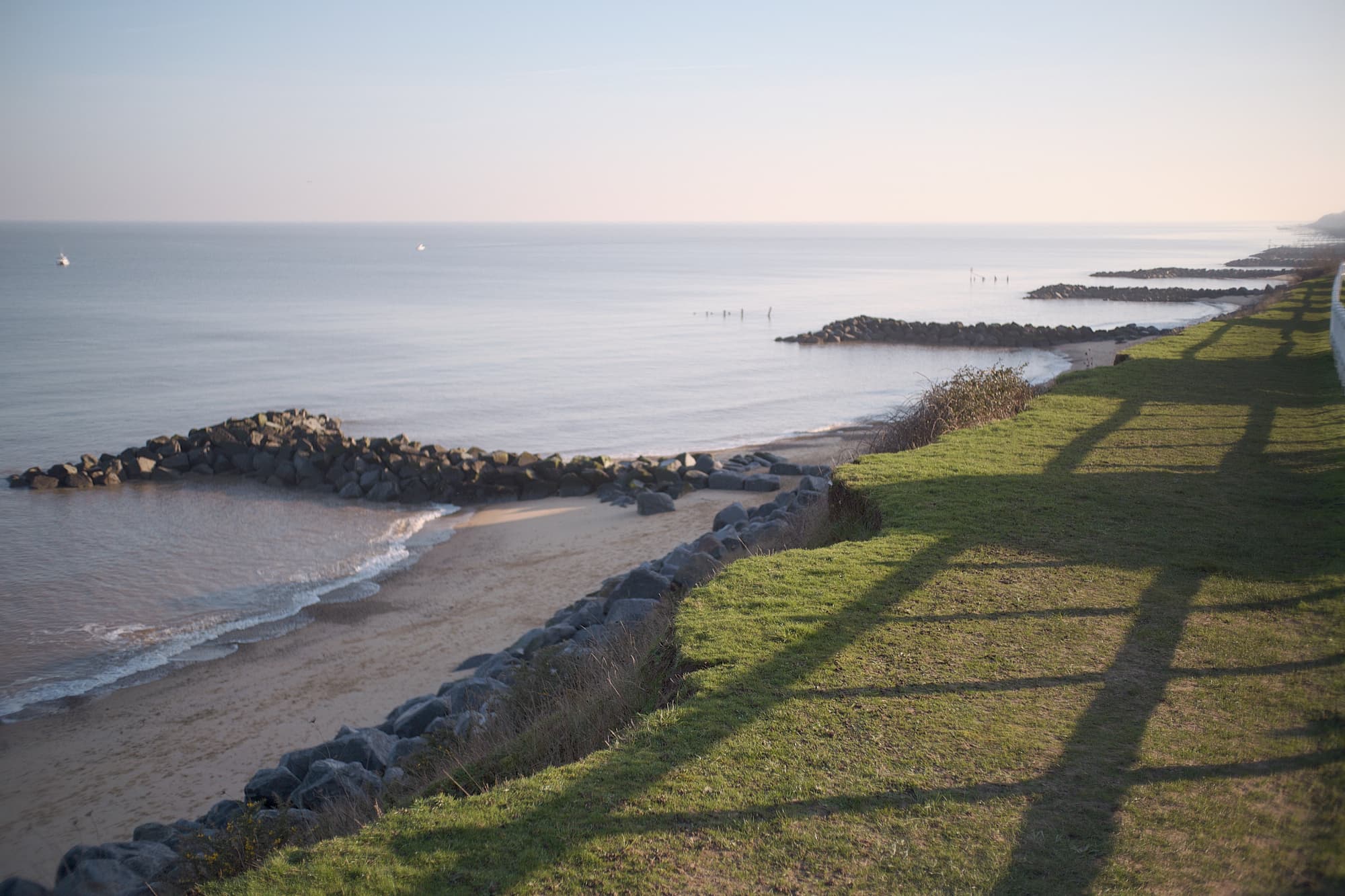 looking out over the cliffs of Hopton beach to a calm evening sea