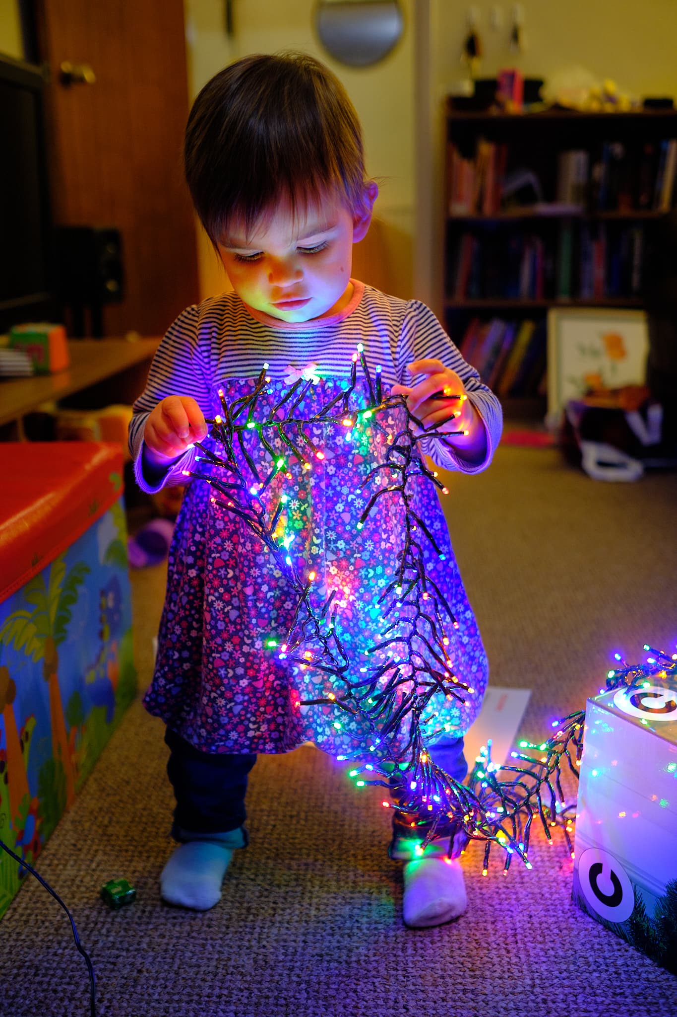 Emily playing with the Christmas fairy lights