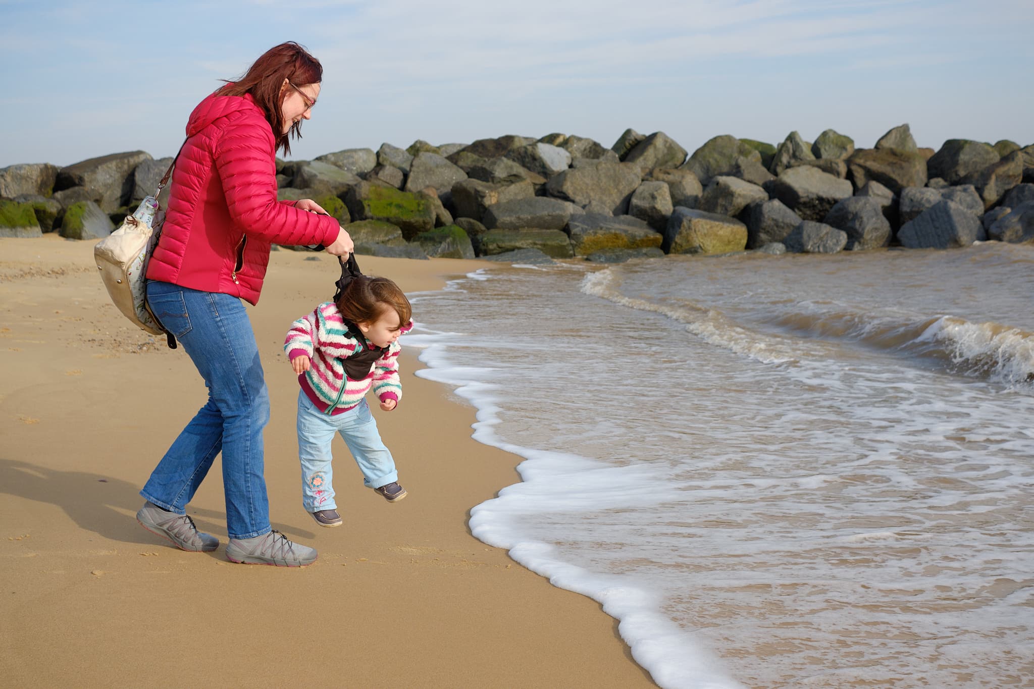 Zoe hoisting Emily away from the sea