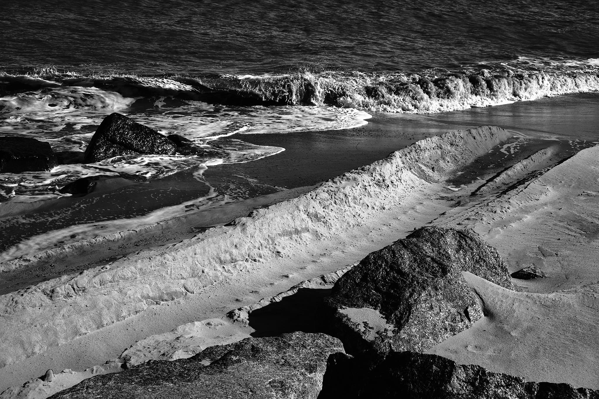 digger tracks in the sand